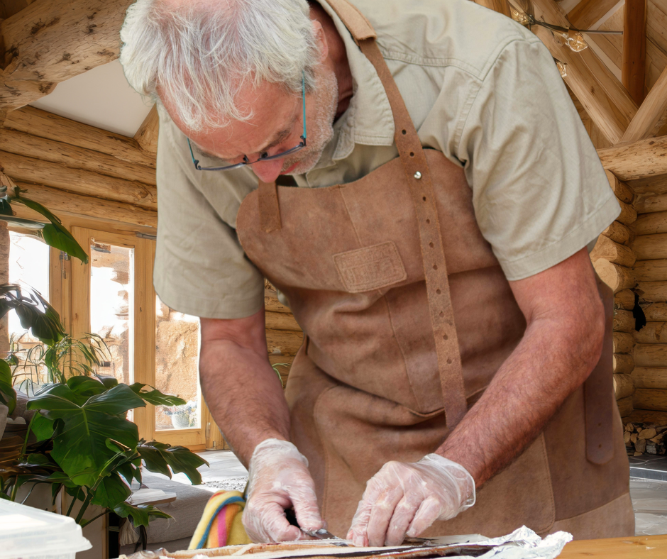 Older man crafting being creative in workspace