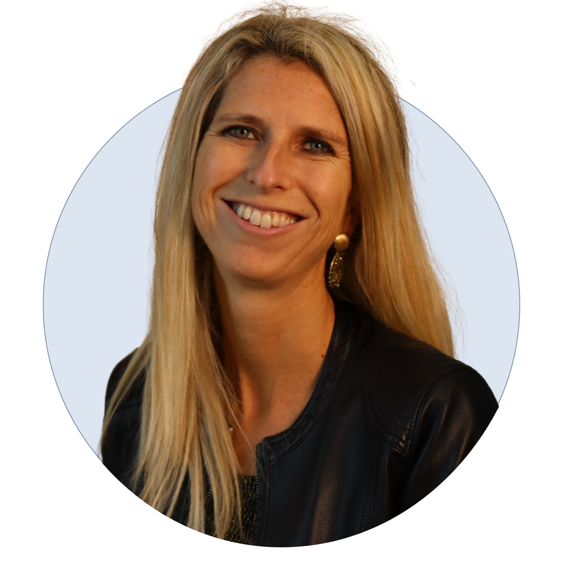 A woman with long blonde hair smiling, wearing a black leather jacket and gold earrings, against a light background.
