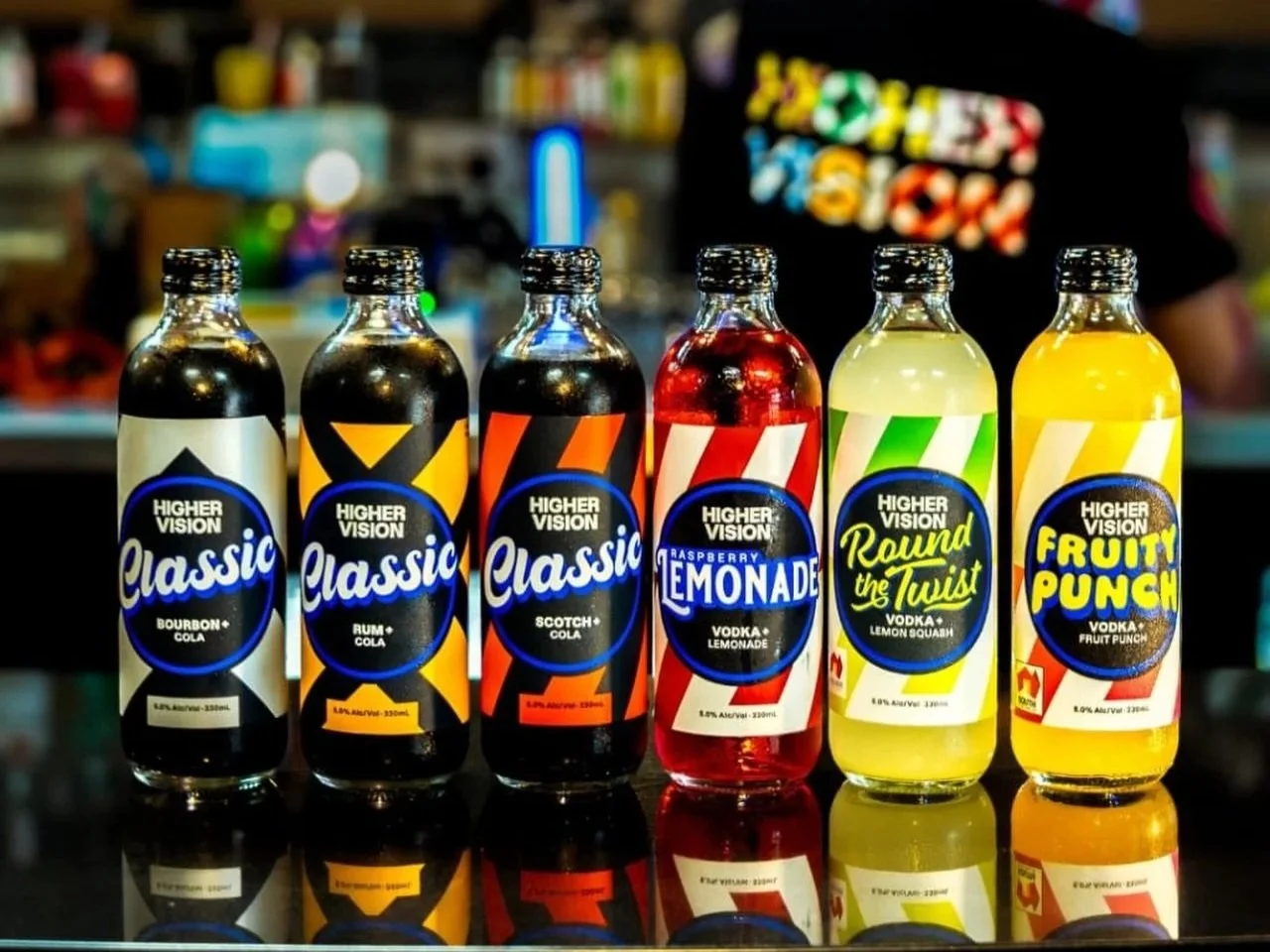 6 bottles of high vision spirits on a table