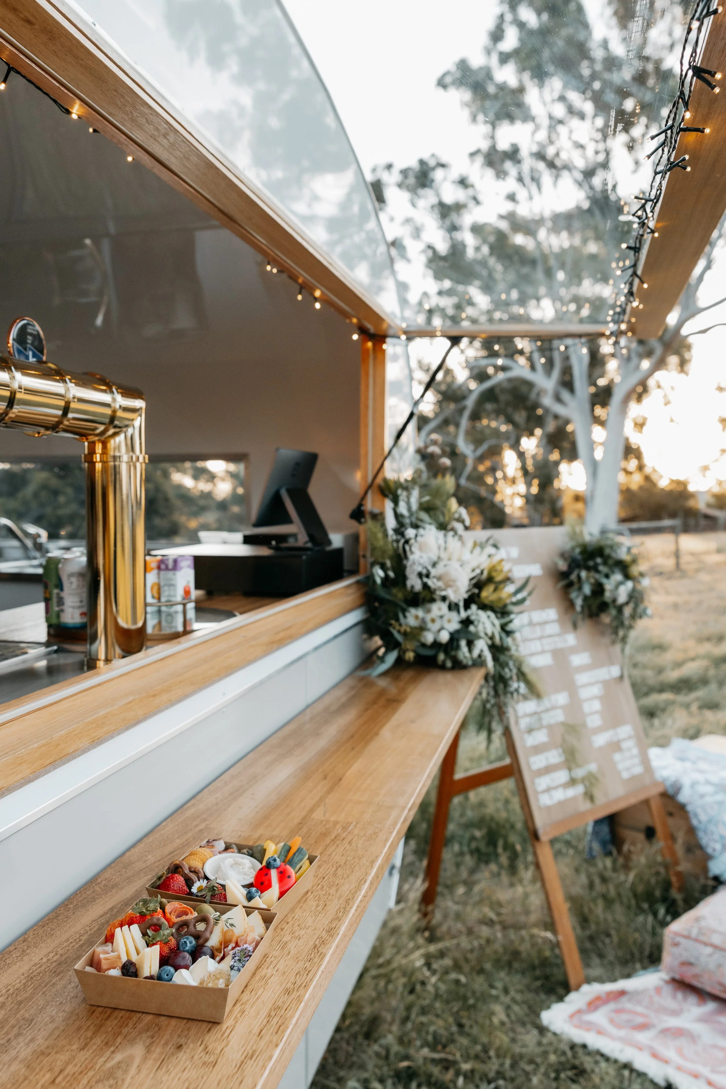 Mobile bar presented with a bunch of flowers on it