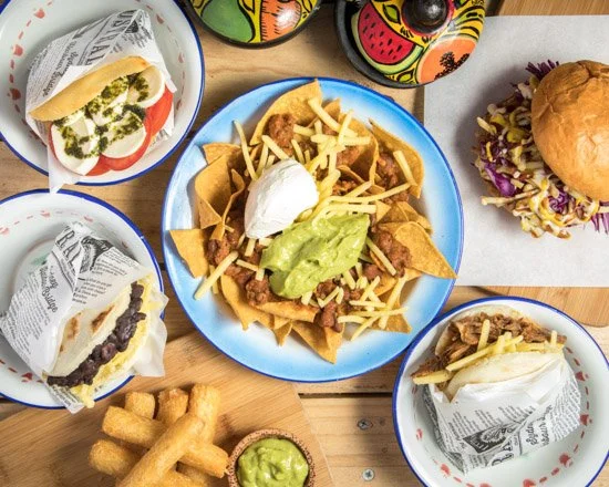Latin American street food dishes on table