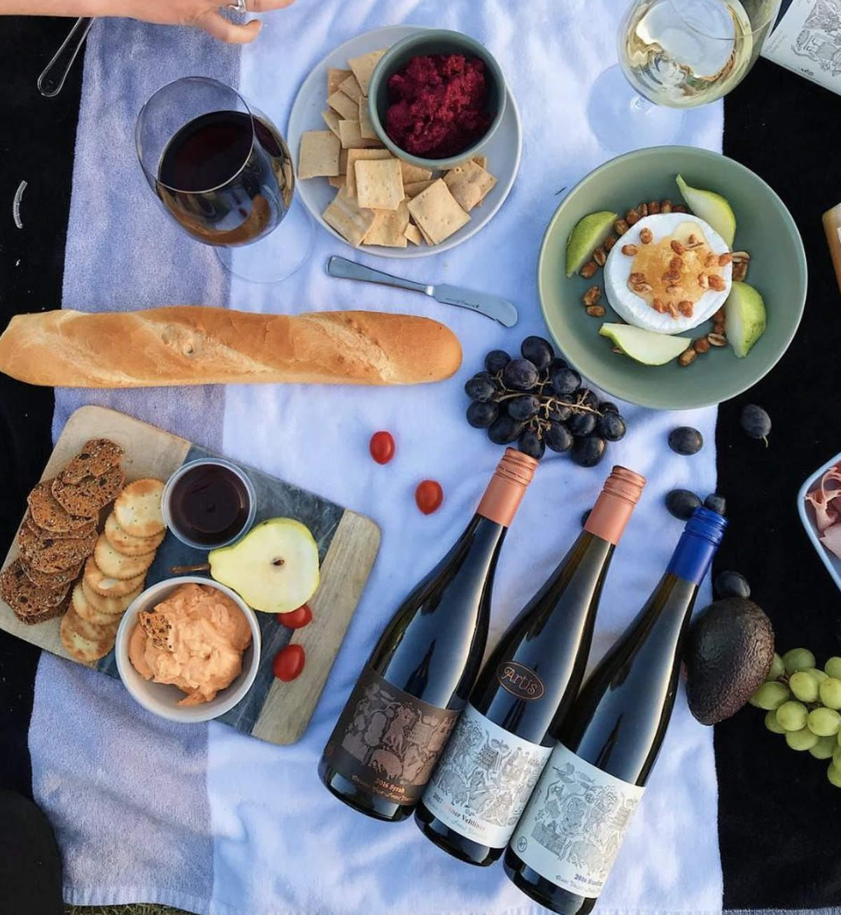 3 Artis Wines on a picnic rug 