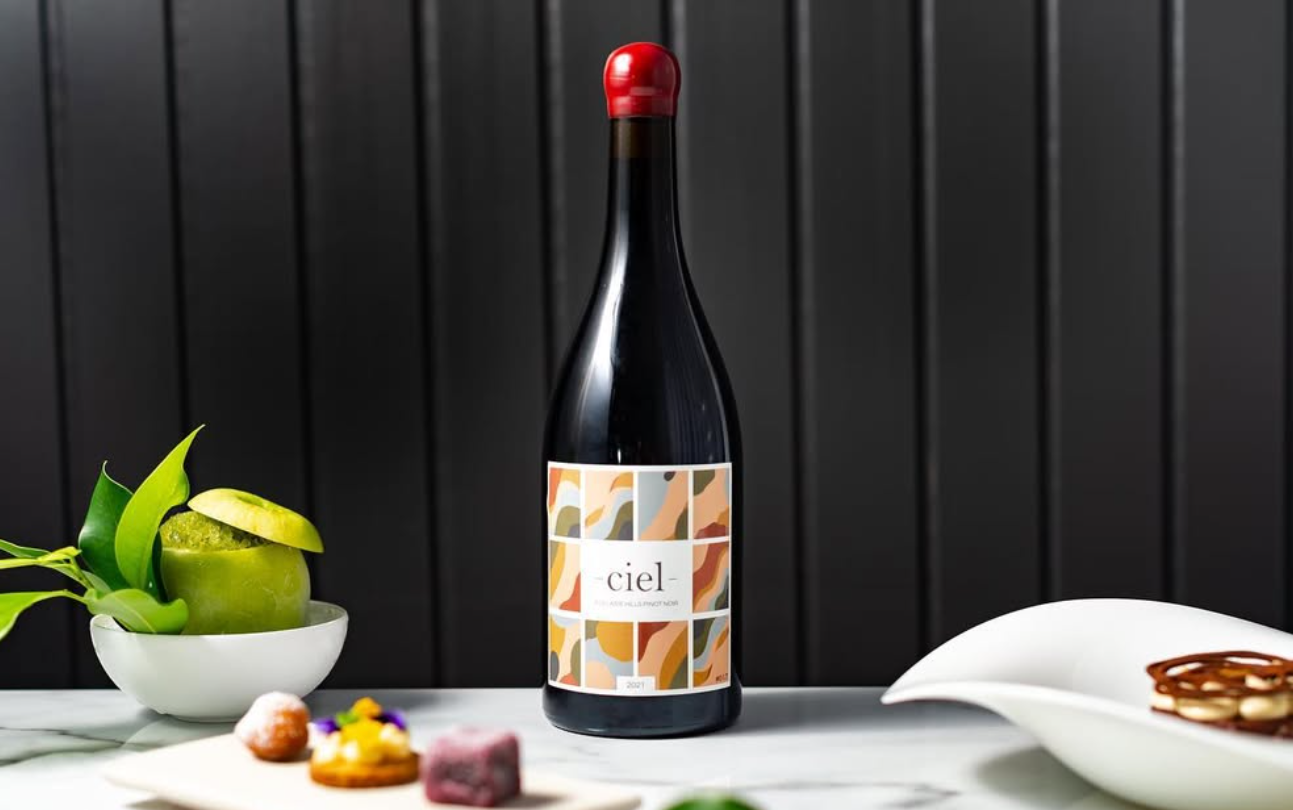 Bottle of Ciel Wine on bench