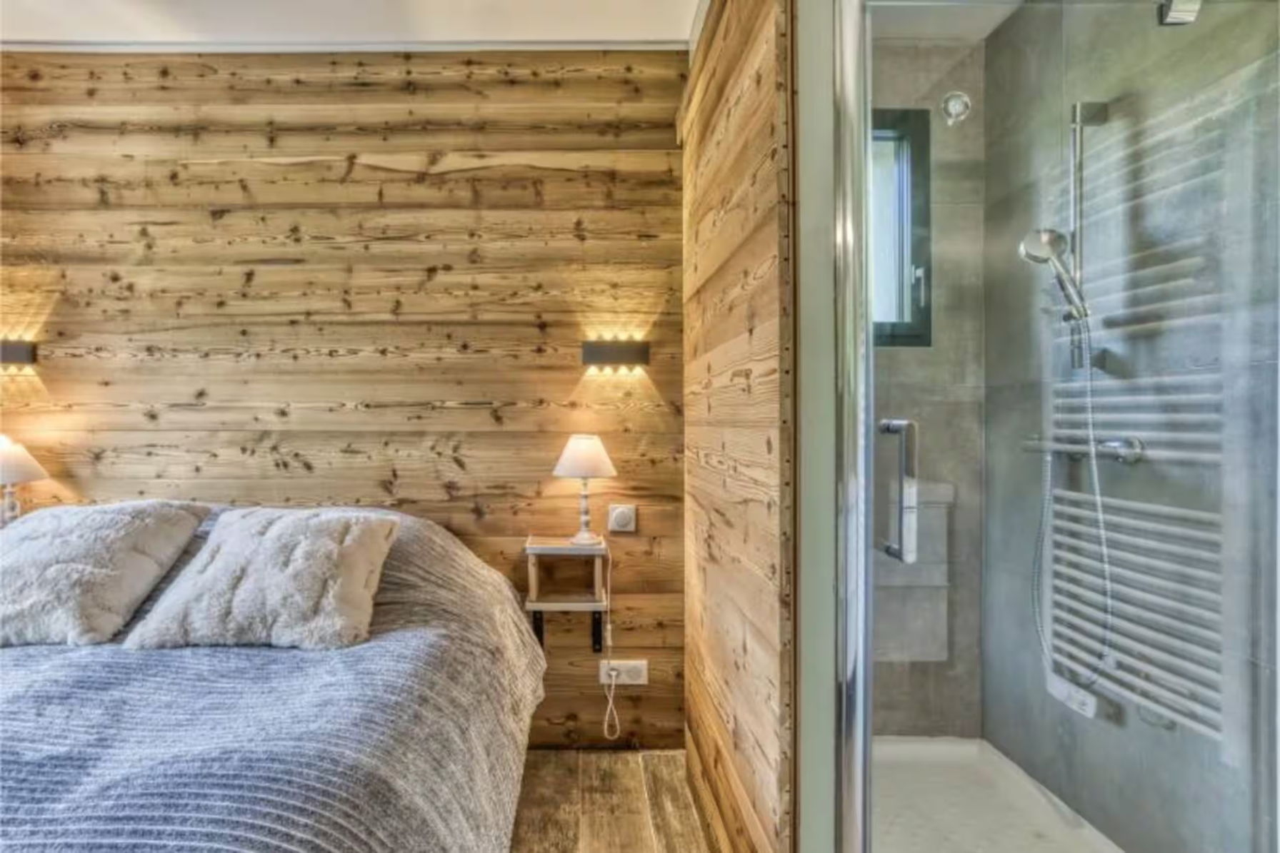 Chalet bedroom with a glass-fronted ensuite