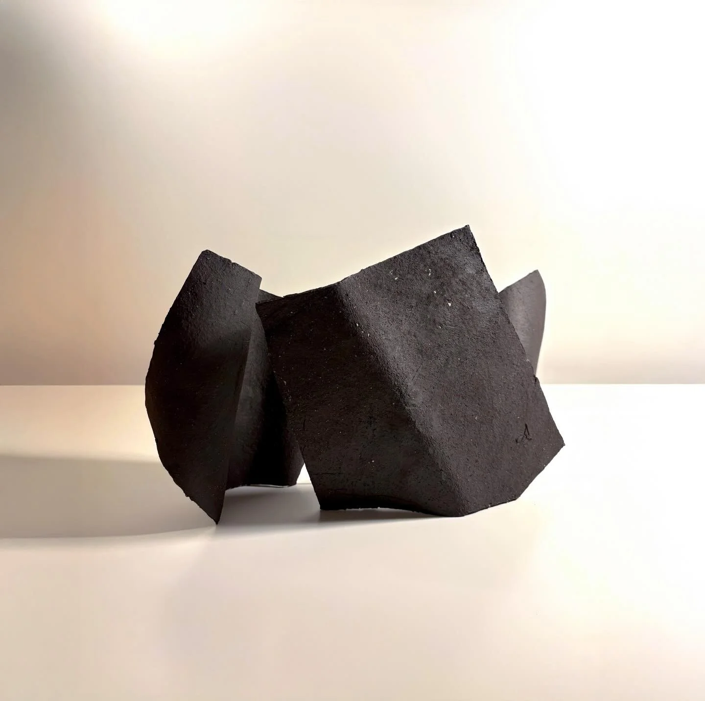 &lsquo;It Holds&rsquo; (2026) Vulcan stoneware clay.  Four elements that self-support through proximity, pressure and balance. Drawing from the logic of roof tiles, the work understands stability as a collective condition rather than an individual pr