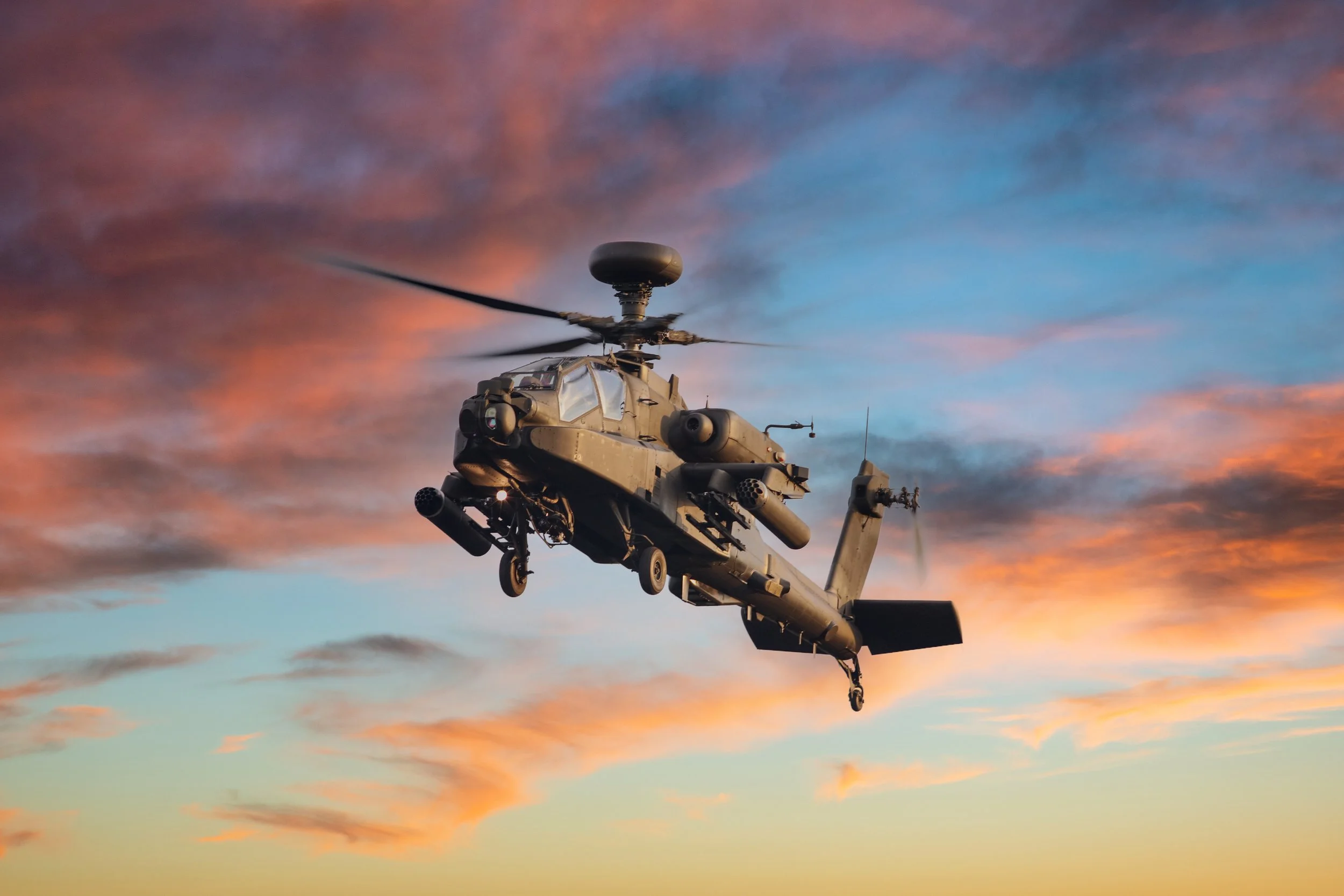 Military helicopter against a dramatic sky
