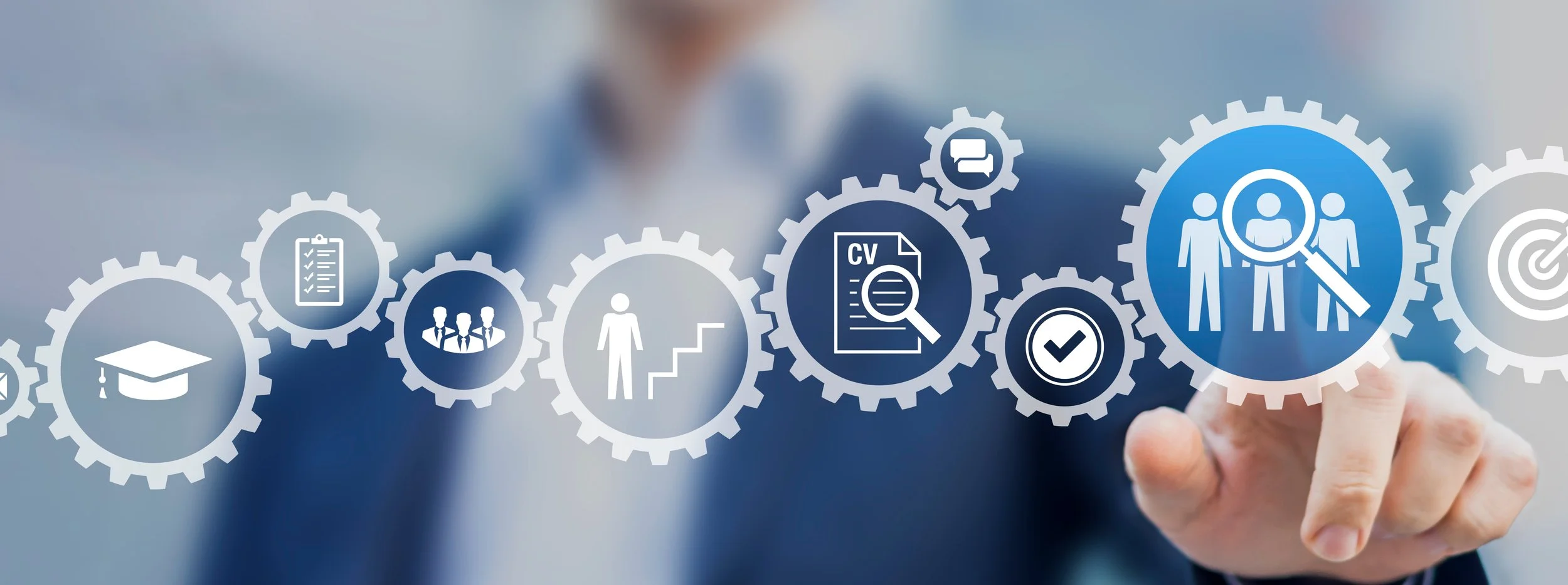 A person in business attire interacts with a digital interface featuring interconnected icons related to education, recruitment, and communication.