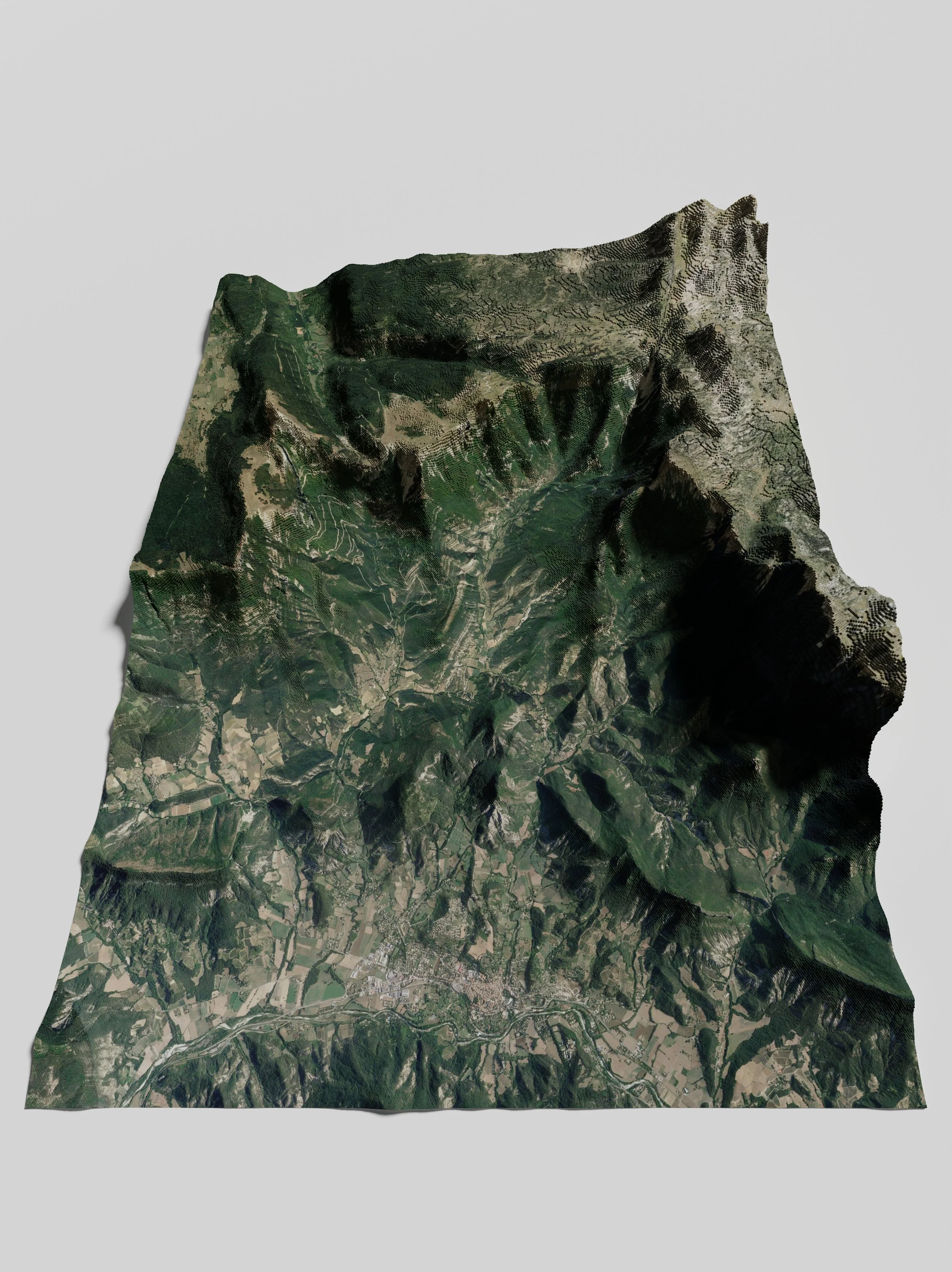 Modèle topographique en relief d'une région montagneuse avec des vallées, monts et zones de végétation verte