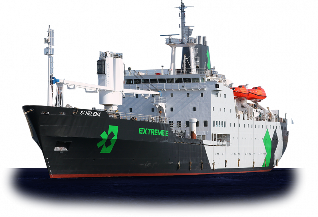 A large rescue or research vessel named 'St. Helena' with the words 'EXTREMEE' and a green recycling symbol on the side, sailing on the ocean.