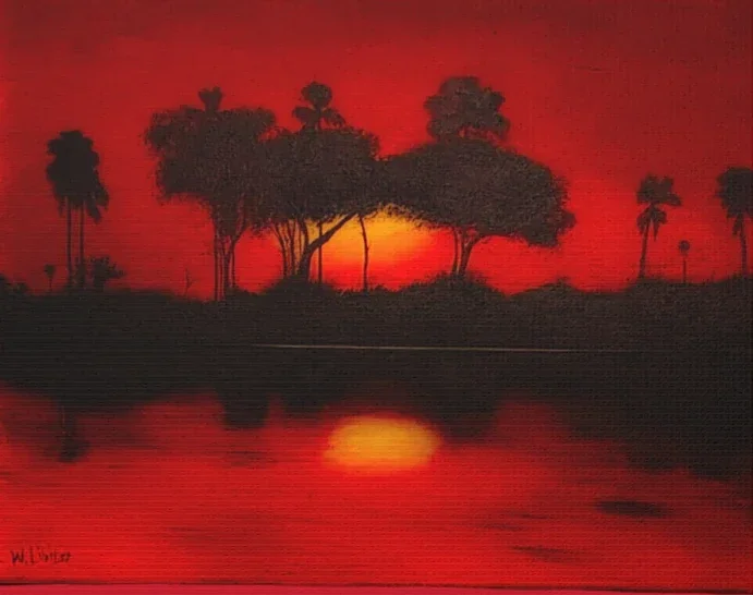 Sunset over a river with silhouetted trees and palm trees on the horizon