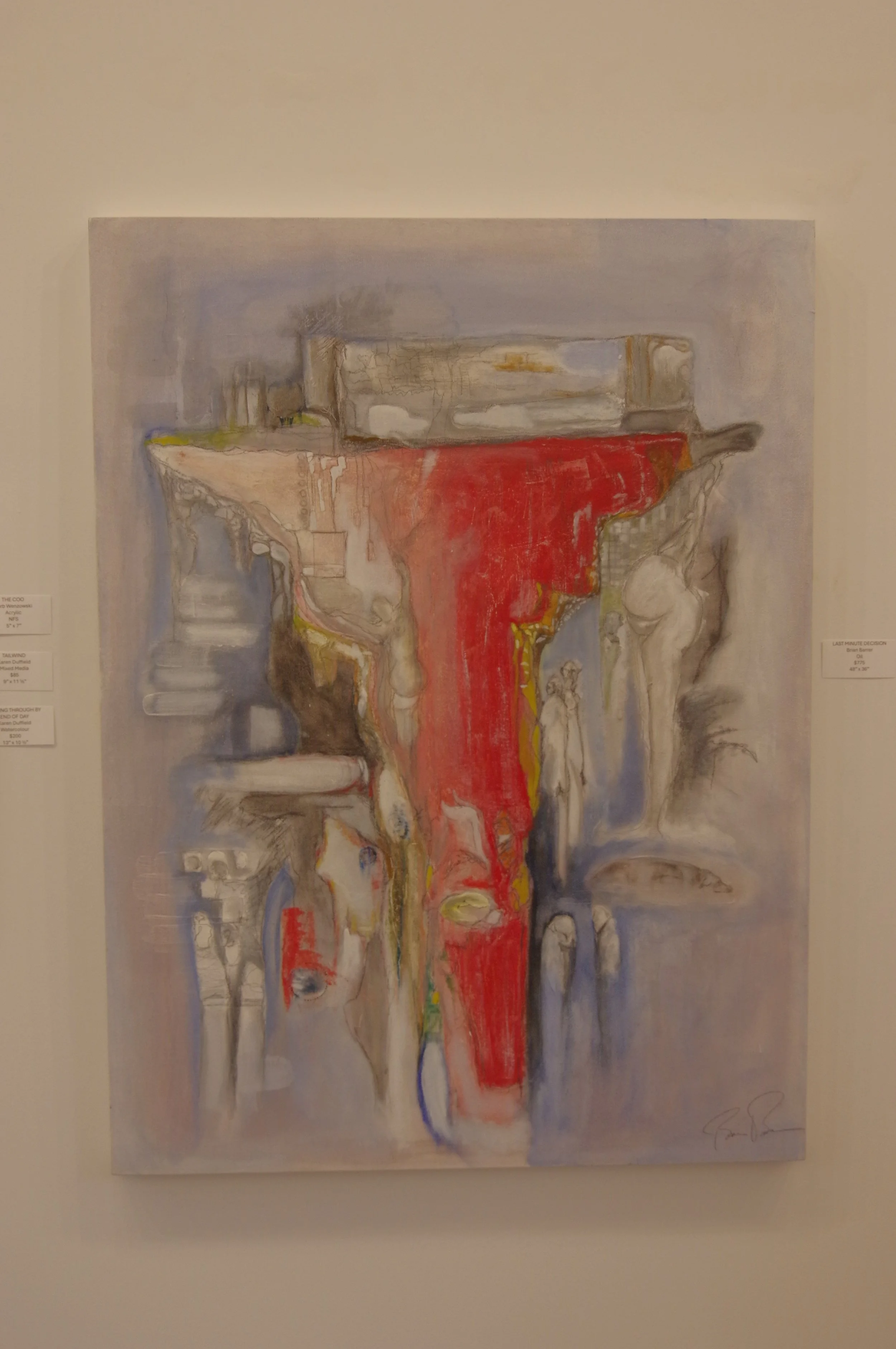 Abstract painting with a dominant red vertical streak and various muted colors, shapes, and textures, displayed on a wall in an art gallery.