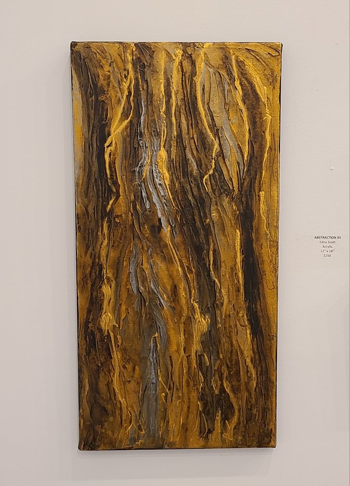 Abstract painting with brown and yellow wavy streaks on canvas.