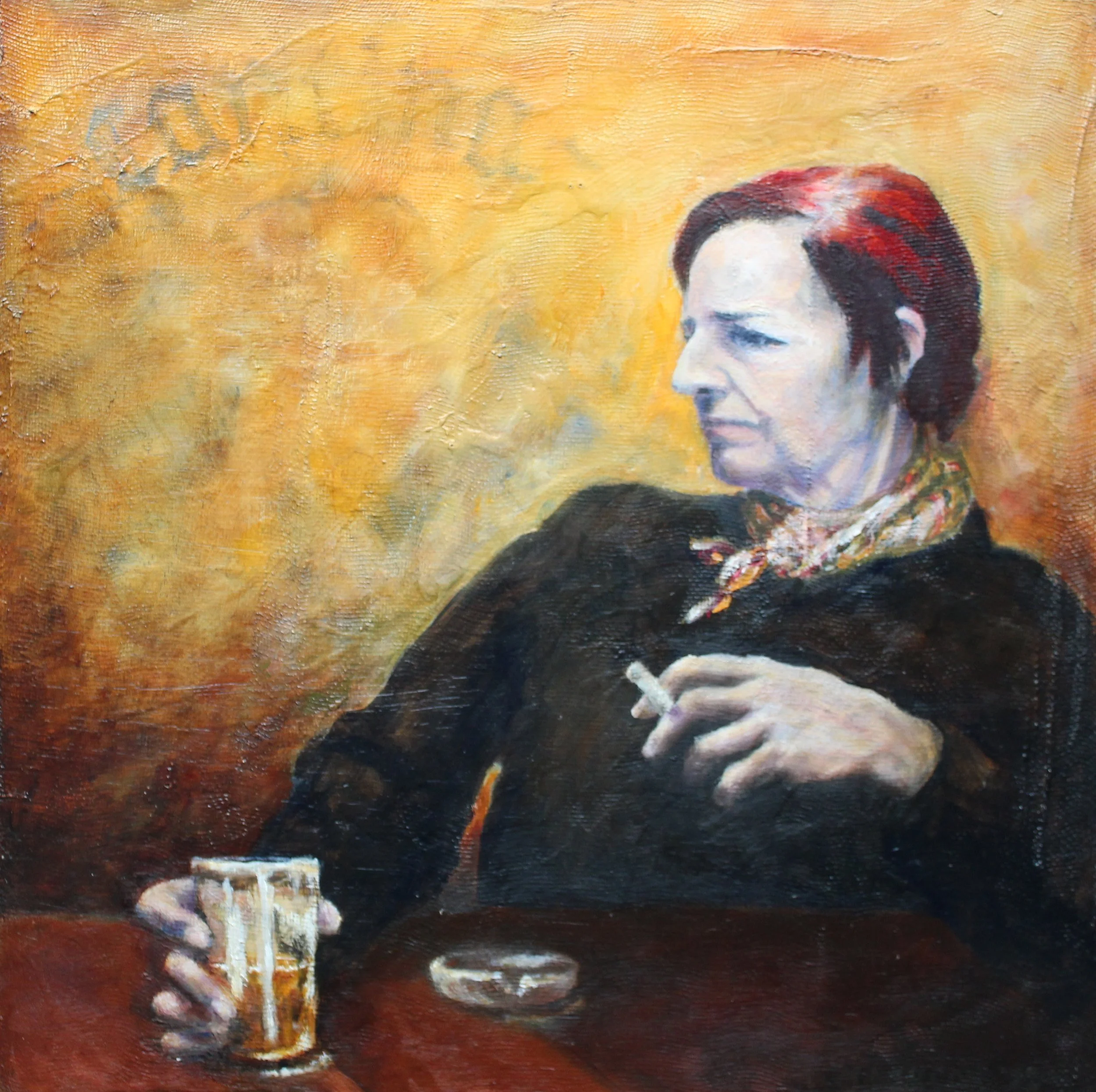 A woman with short dark hair with red highlights, wearing a black top and patterned scarf, sitting at a table with a cigarette in her hand, a glass of beer, and an ashtray, against a warm, textured yellow-orange background.