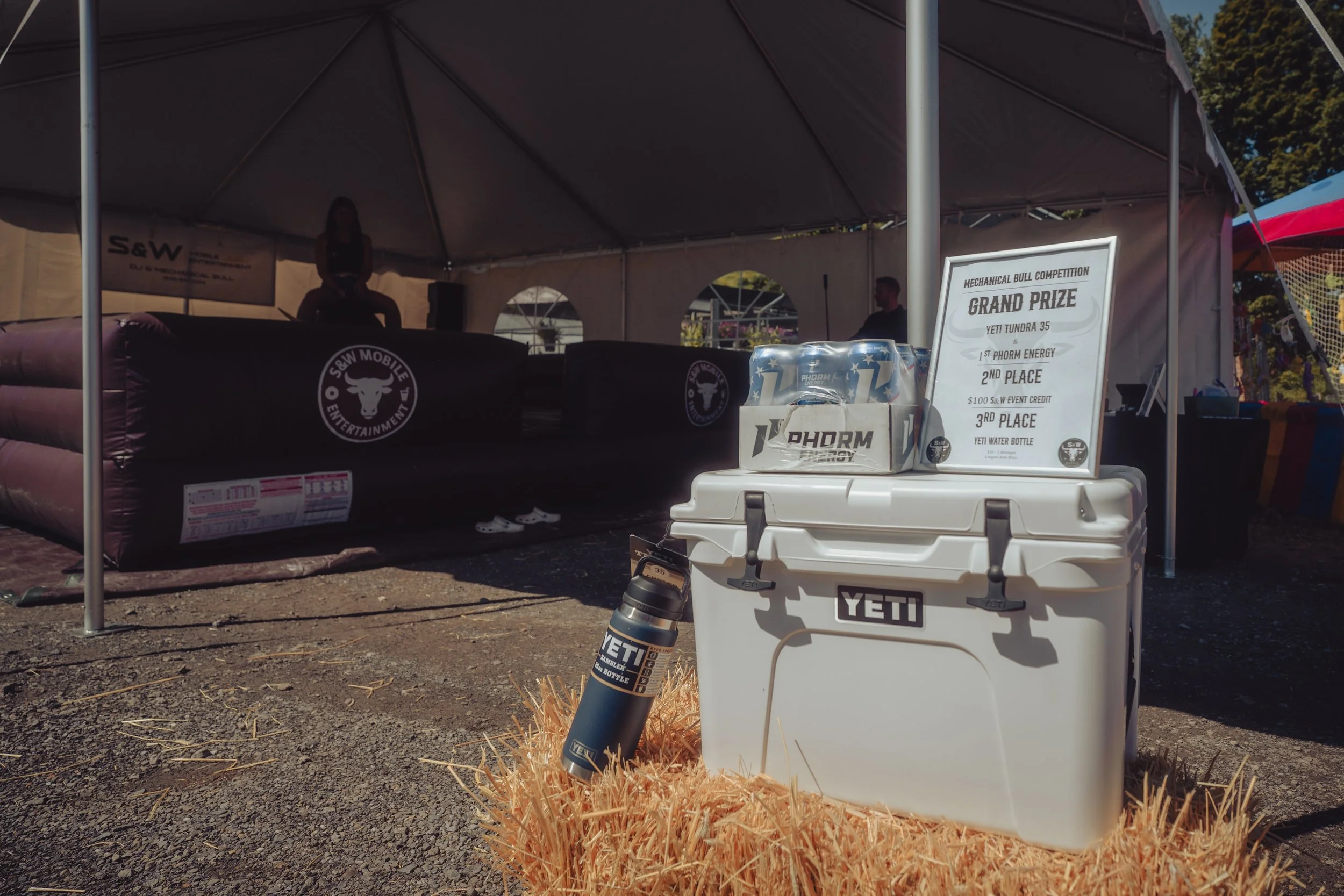 An outdoor Mechanical bull competition hosted by S&W Mobile Entertainment with the grand prize of a Yeti cooler and case of 1st Phorm Energy Drinks in Dutchess County New York.