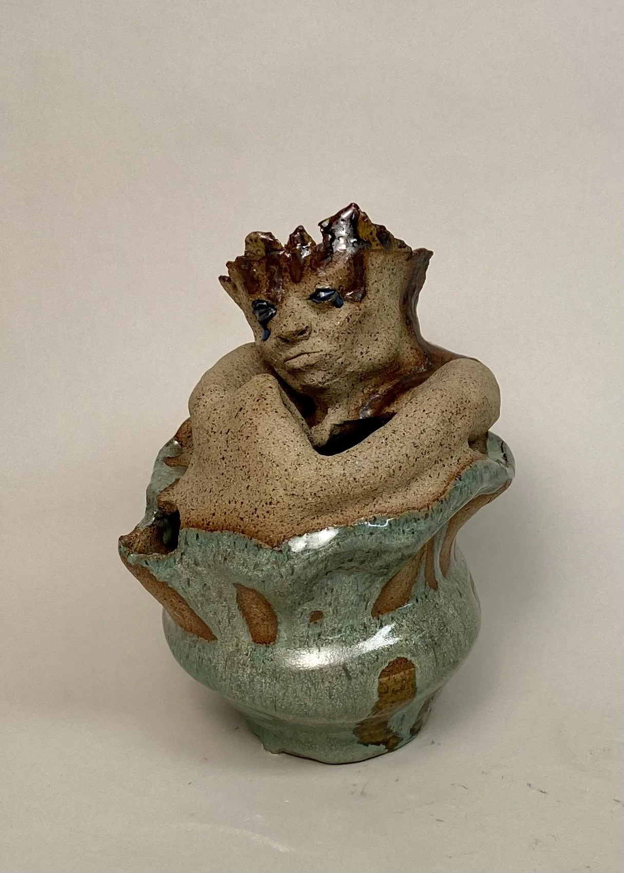 A Study in Loneliness, Spring 2021.
Roughly 14" tall, 10" wide, raw clay and glaze
Sculptural depiction of humanoid figure hugging itself. I enjoyed playing with the texture of clay vs texture of glaze.

