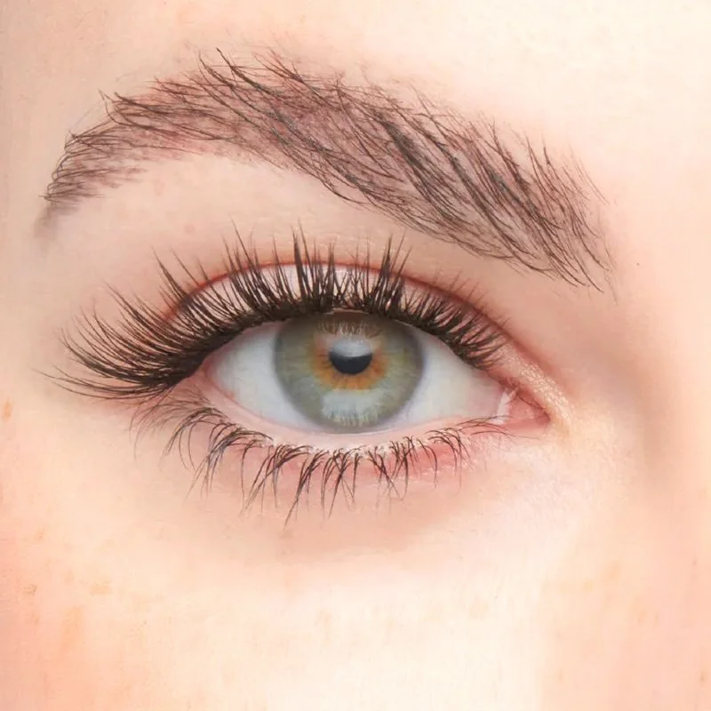 Close-up of a human eye with makeup, including long eyelashes and well-groomed eyebrow.