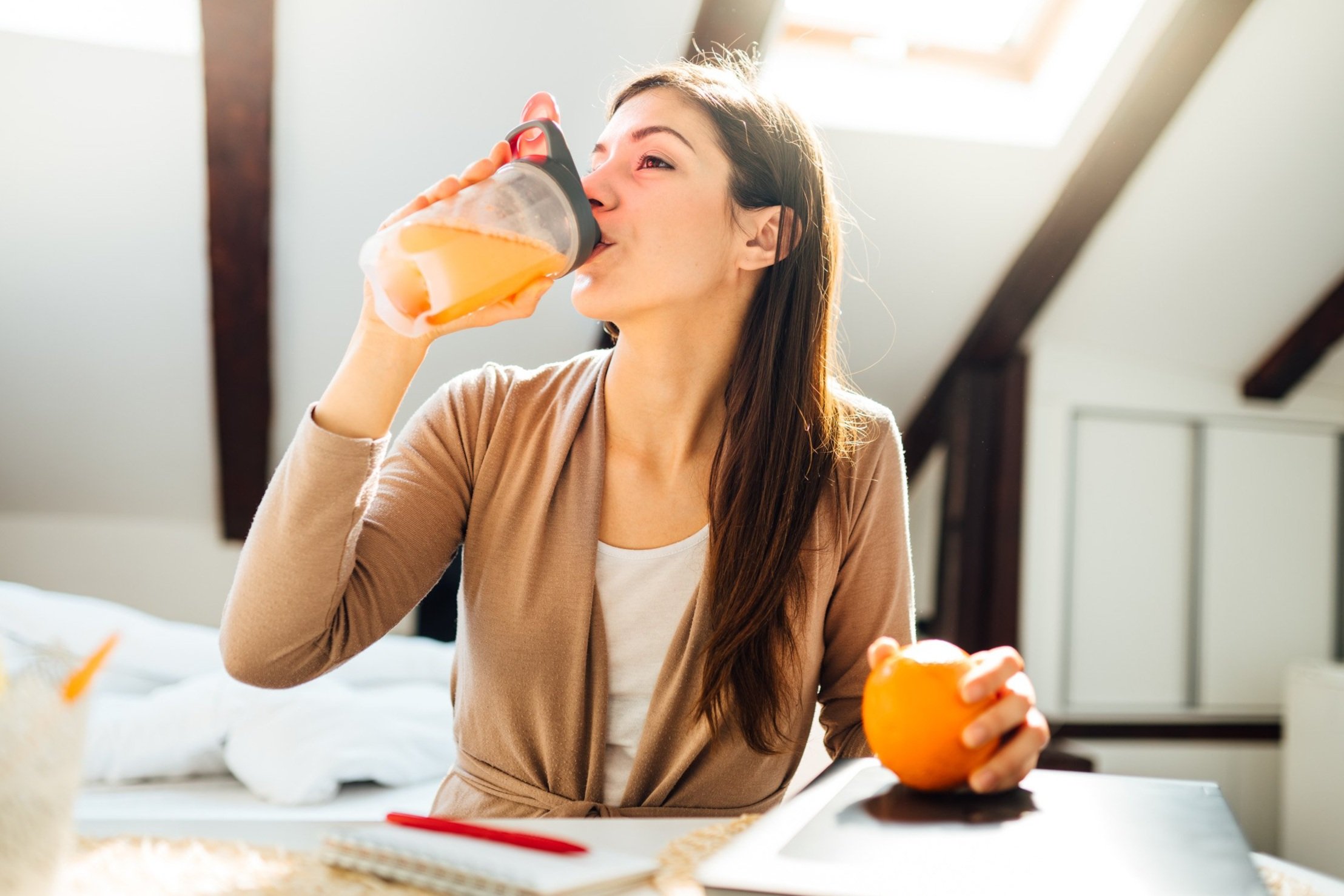 Woman drinking orange juice
