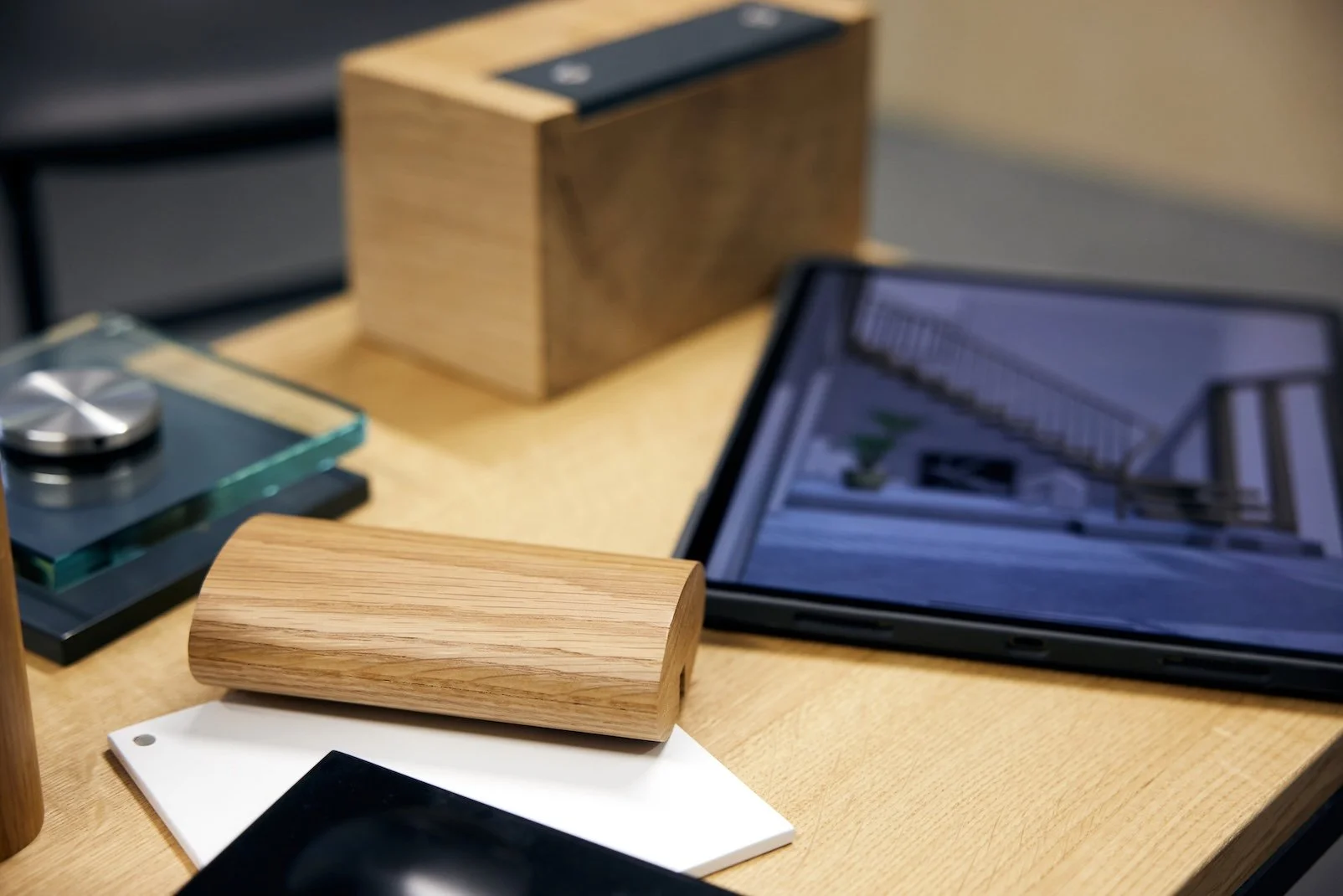 Pieces of wood and a tablet on top of a workshop table