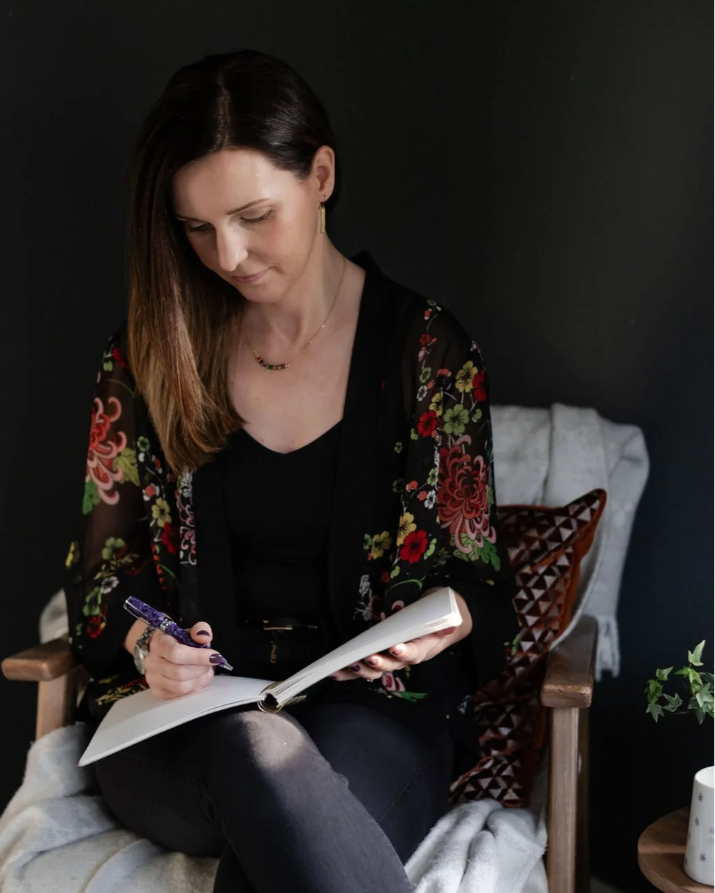 Genna Nelson nutritional therapist and genetic nutritionist working in a quiet, reflective space