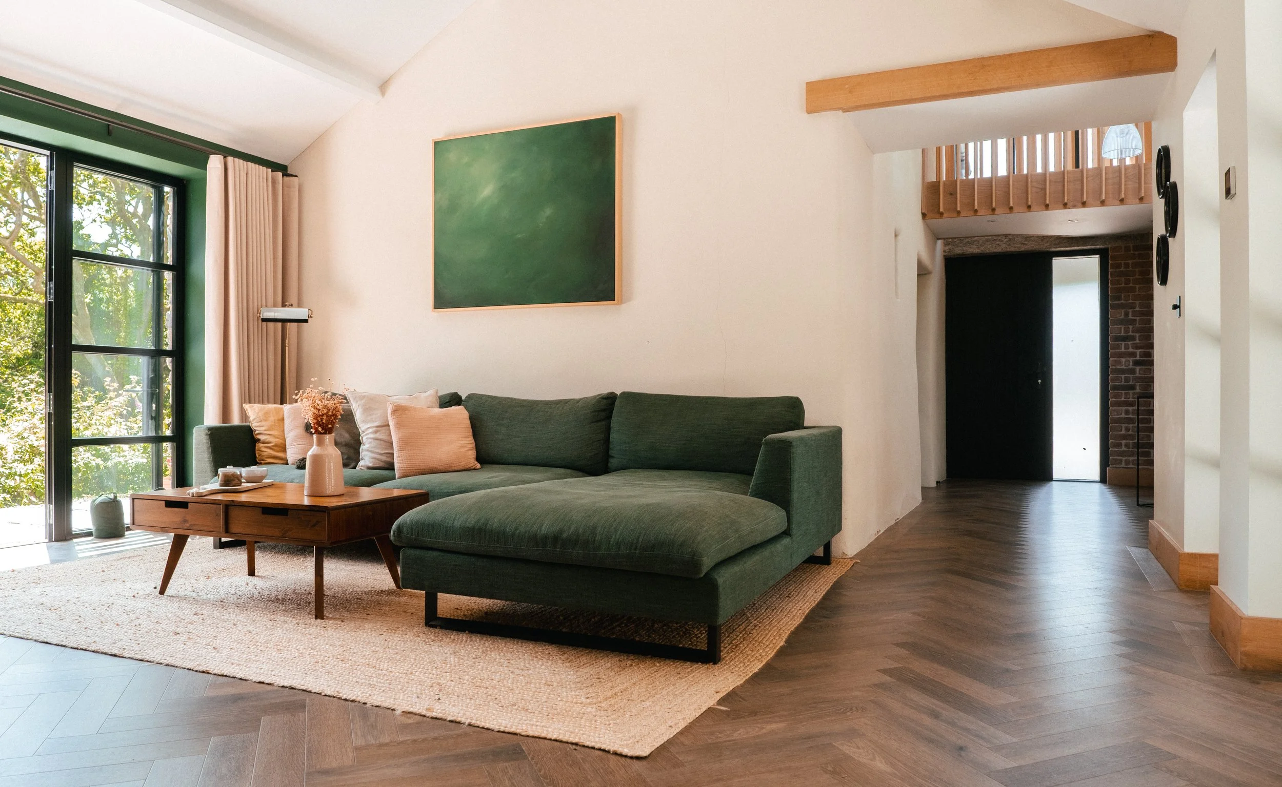 Generous, light-filled and quietly refined, the living space is designed for slow mornings and long, easy evenings. Soft textures, natural tones and woodland views create a setting that feels both grounded and indulgent.