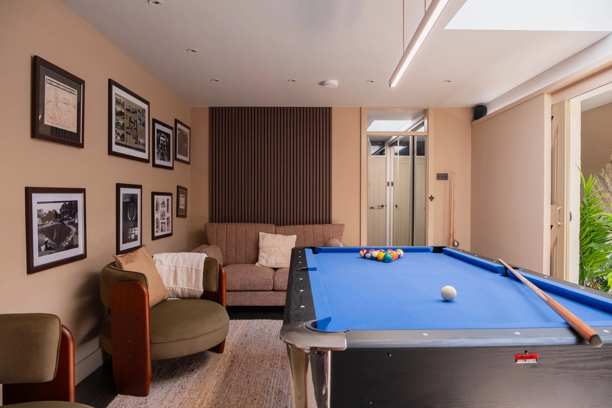 Enjoy a friendly game of pool in Underhill’s dedicated games room, complete with relaxed seating, framed artwork and doors opening onto the garden.
