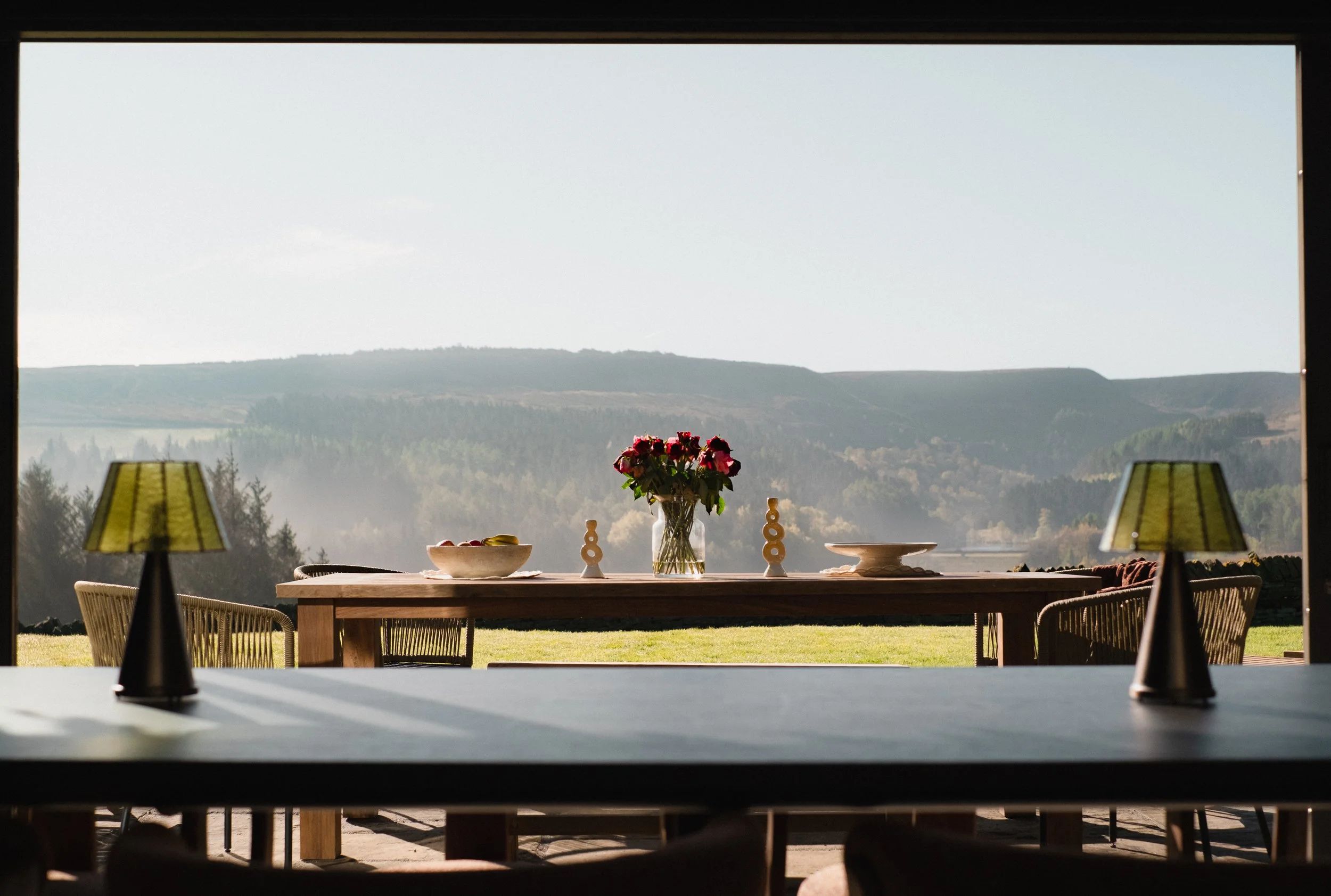 Admire Underhill’s sweeping countryside views from the dining area, perfectly framed by expansive floor-to-ceiling windows.