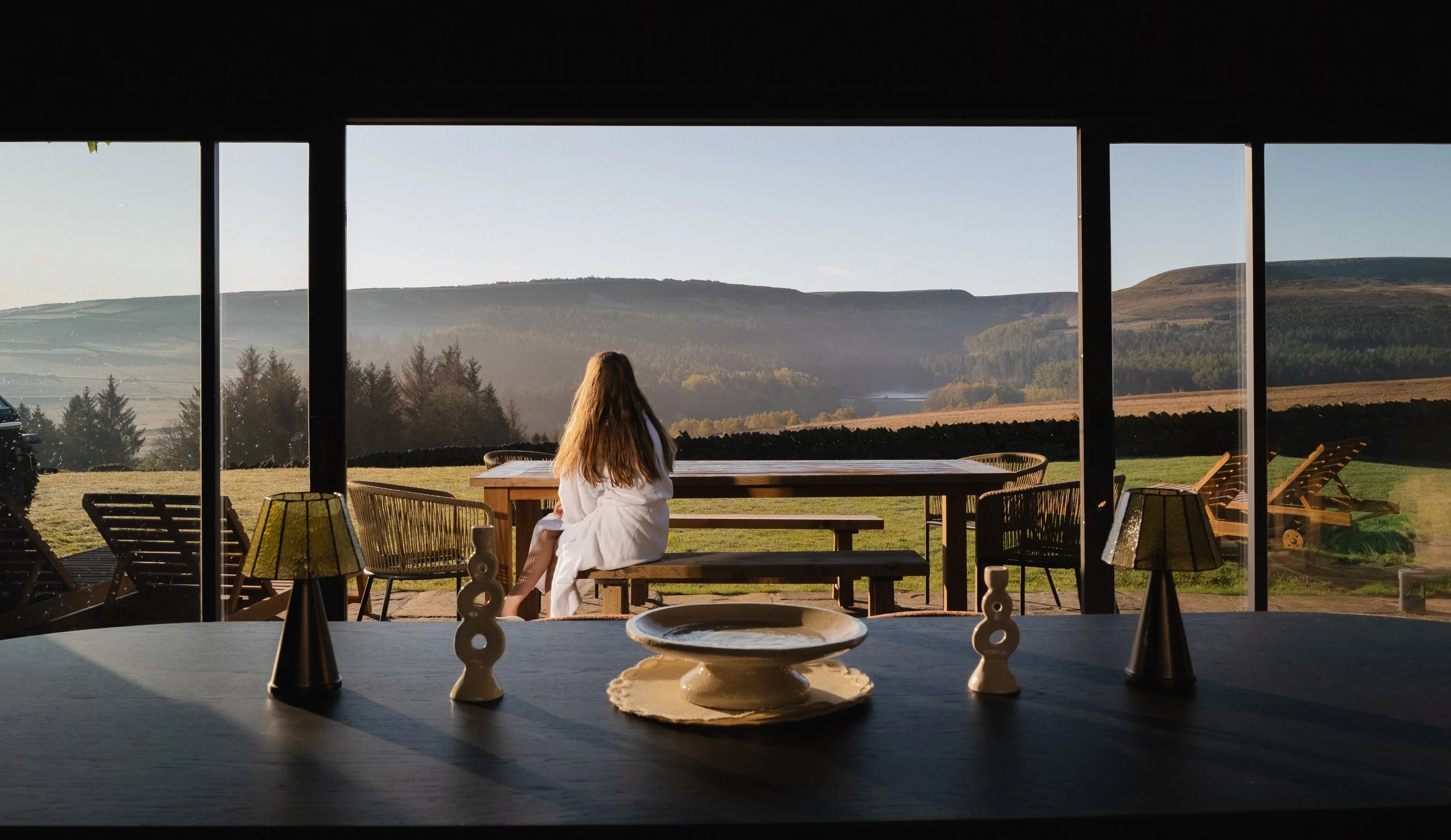 Take in Underhill’s uninterrupted countryside views through the floor-to-ceiling windows, extending seamlessly onto the sunny outdoor terrace.