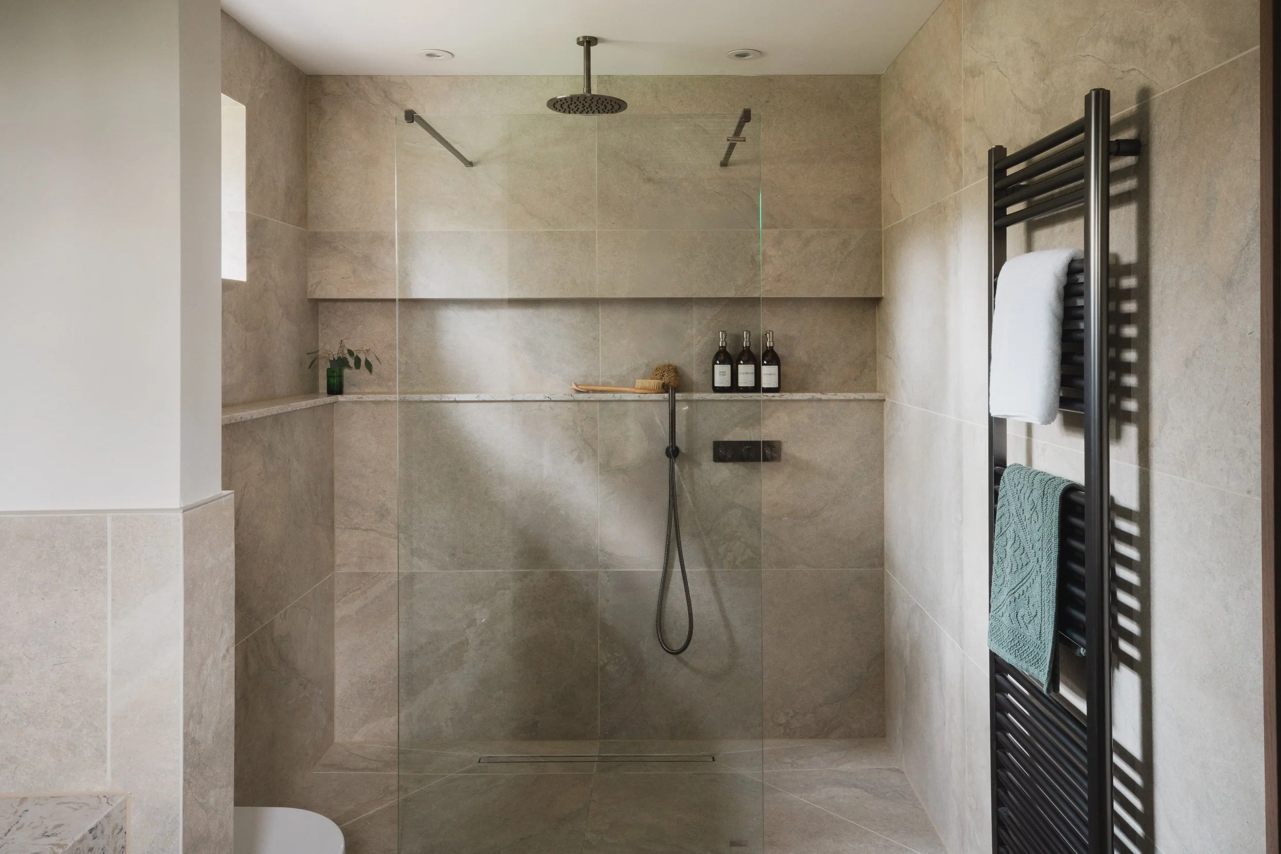 Step into the rainfall shower, where soft stone tones, clean lines and gentle, cascading water create a calm, spa-like moment to start or end the day.