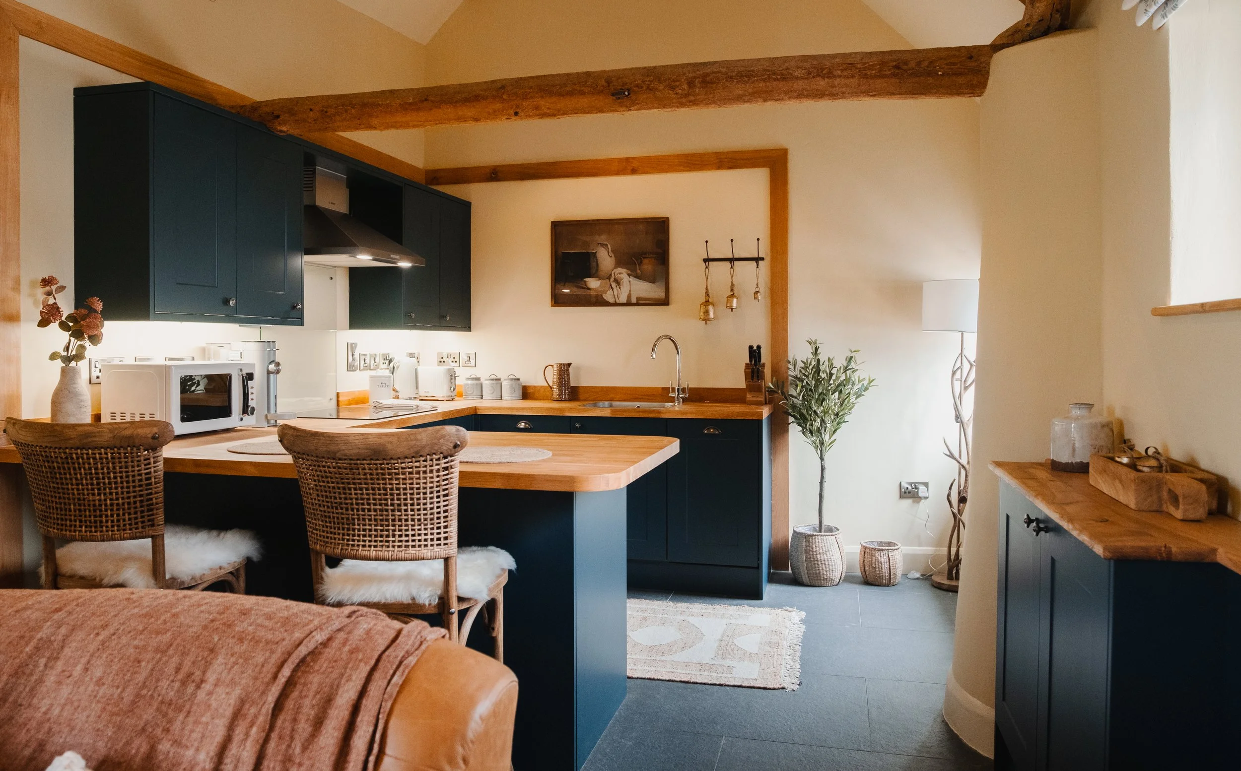 At the heart of the cottage, a handcrafted kitchen invites slow mornings, shared cooking, and unhurried evenings spent together.