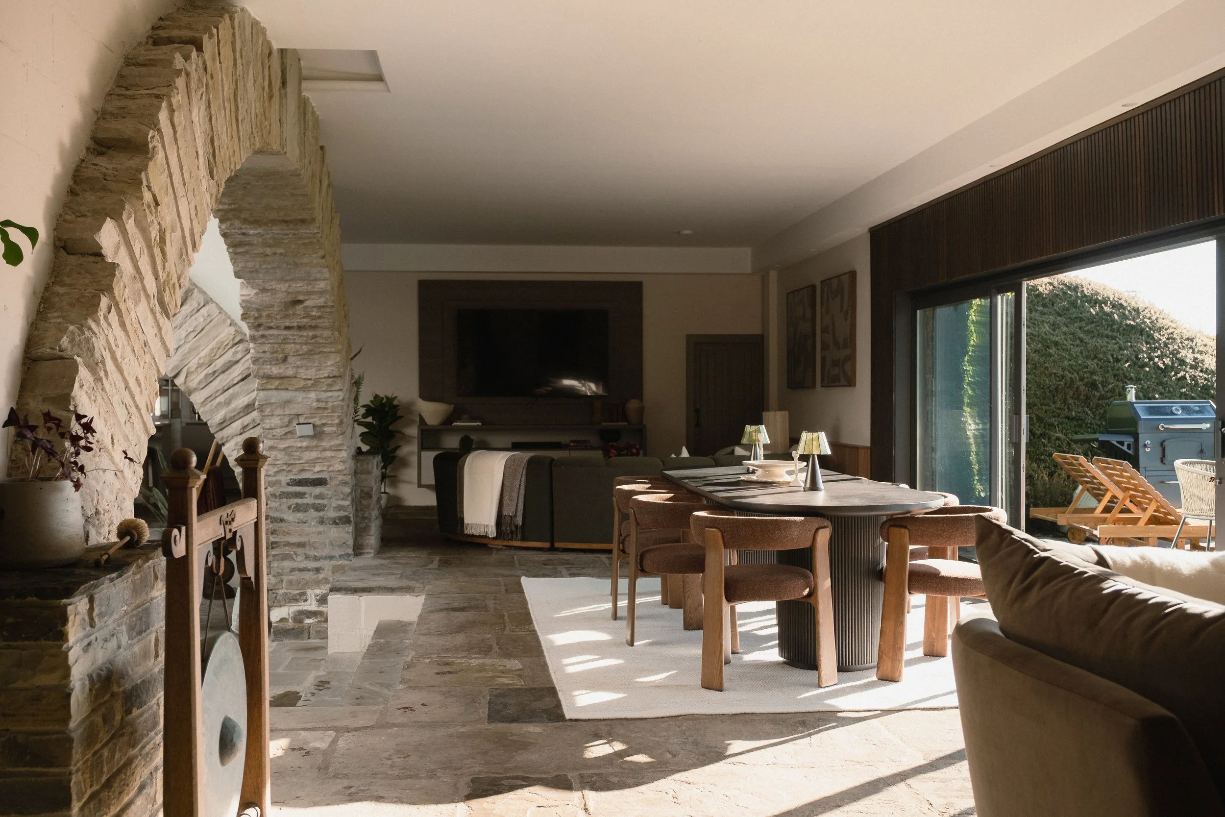 Dine in Underhill’s light-filled open-plan space, where original stonework meets contemporary furnishings and floor-to-ceiling windows overlook the garden.