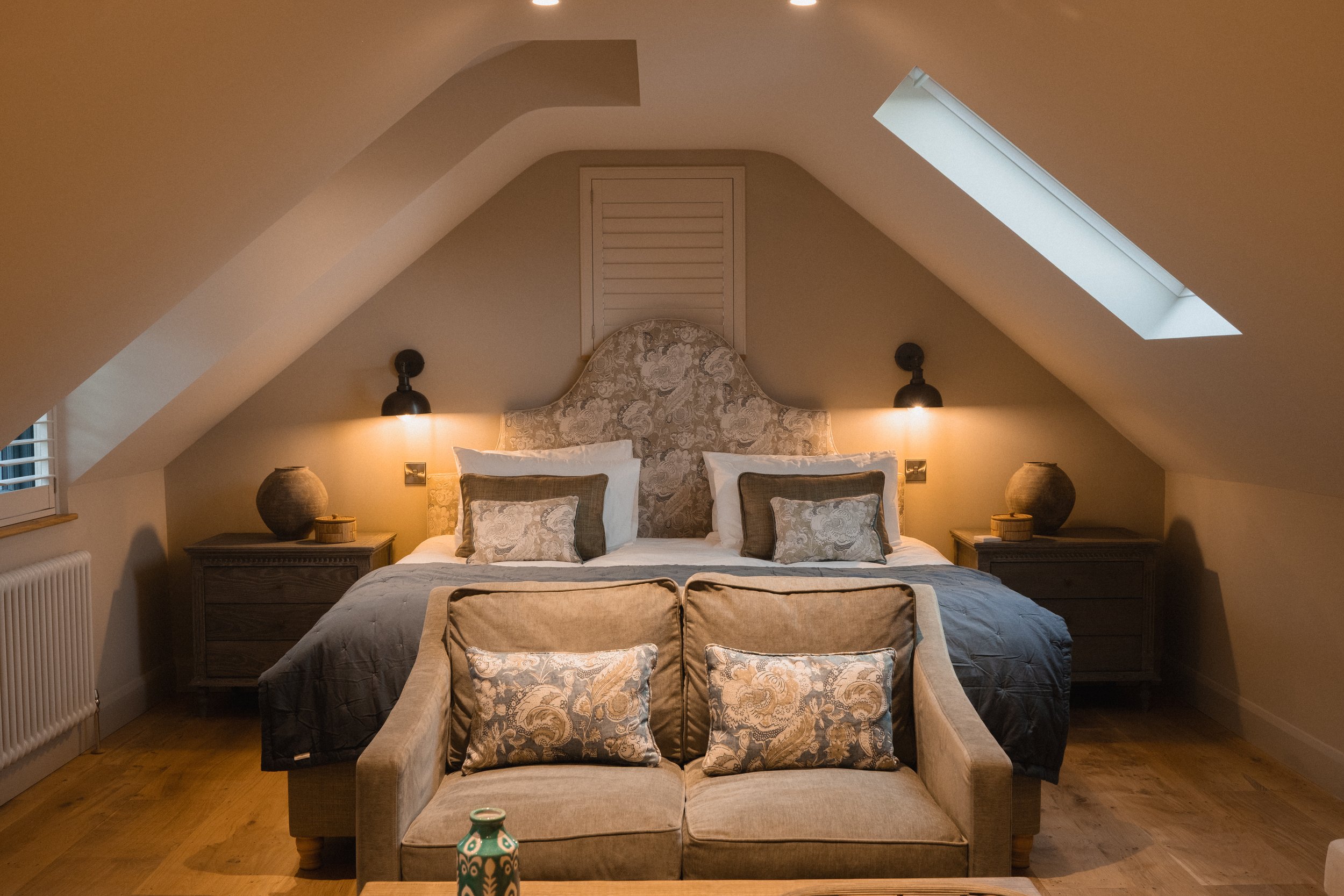 the emperor master bedroom reveals itself as a serene and beautifully balanced retreat, tucked beneath vaulted ceilings and softly lit by skylights. 