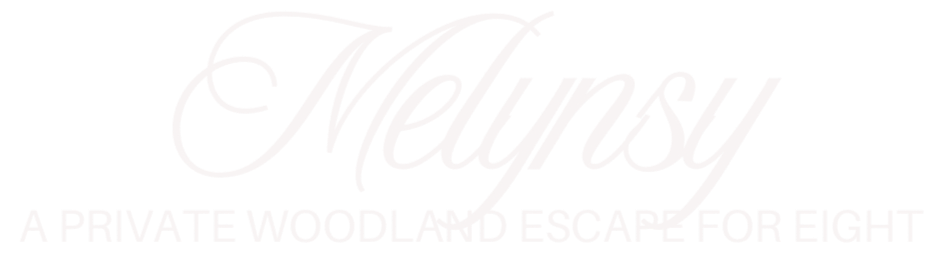 Logo with the word 'Melyns' in cursive font and the phrase 'A private woodland escape for eight' underneath in all caps.