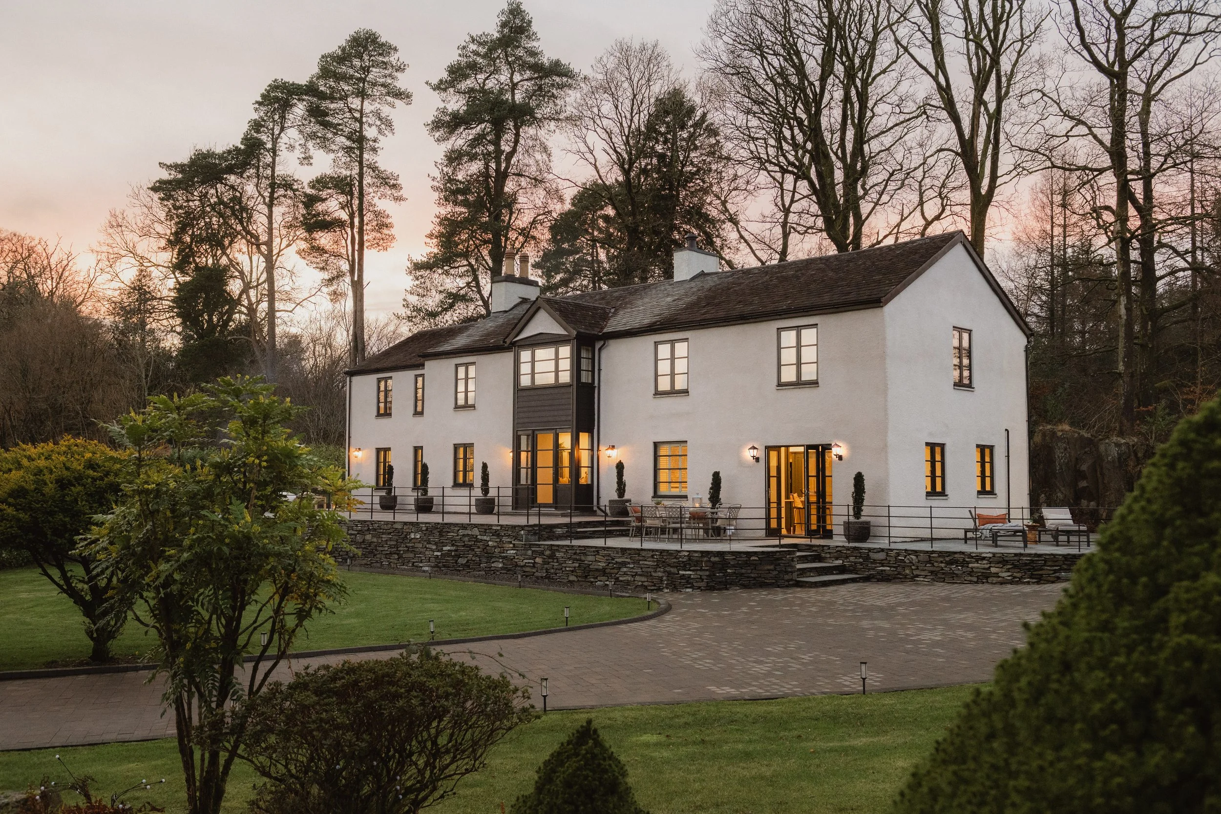 As the light fades, the house starts to glow - a place that feels just as inviting from the outside as it does once you’re in.