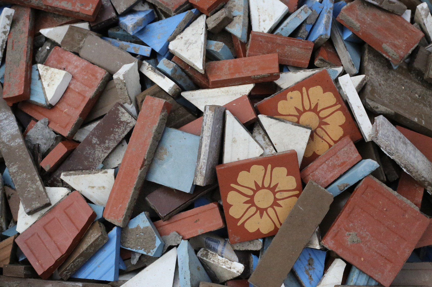 Old entrance tiles before being restored and reinstalled 