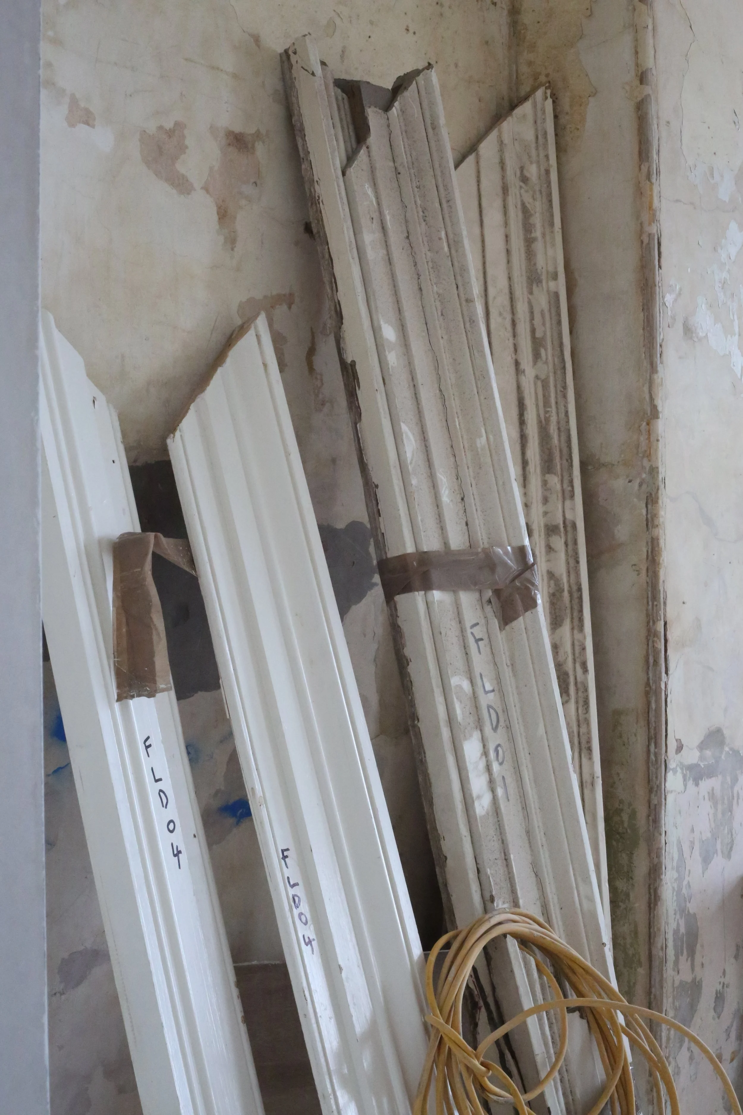 Original skirting being numbered and restored in order to reinstall in their original place