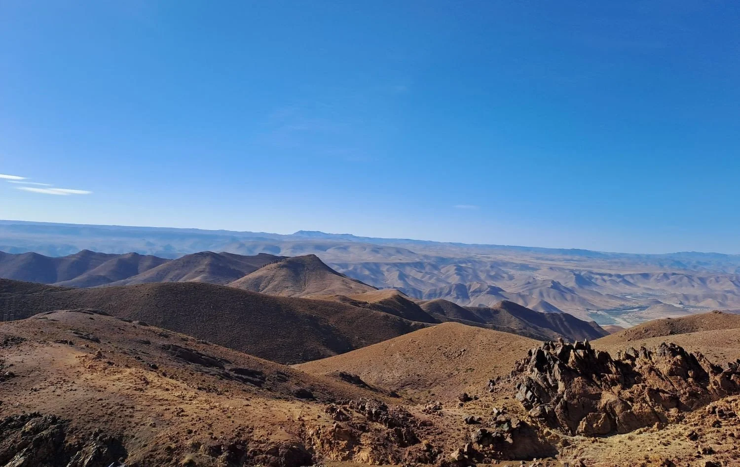 Anti-Atlas desert landscape under a clear blue sky near Taliouine.
