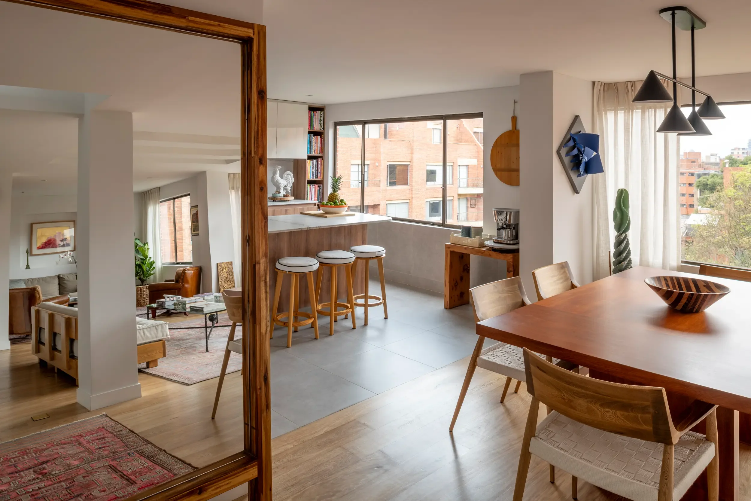 Interior furniture of a renovated Bogotá apartment, brightening the living area