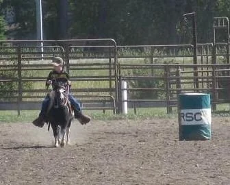 Douglas and Spotsie-competing in Barrels