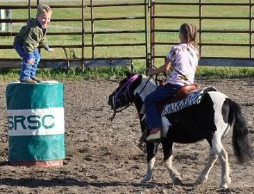Lexi and Gage-monkey on a barrel