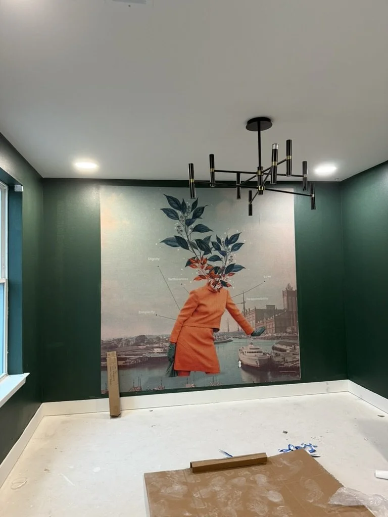 In-progress resident lounge featuring forest green walls, black chandelier, and a Frank Moth mural at East 9th in Dallas, TX, by Artbuckle & Co.