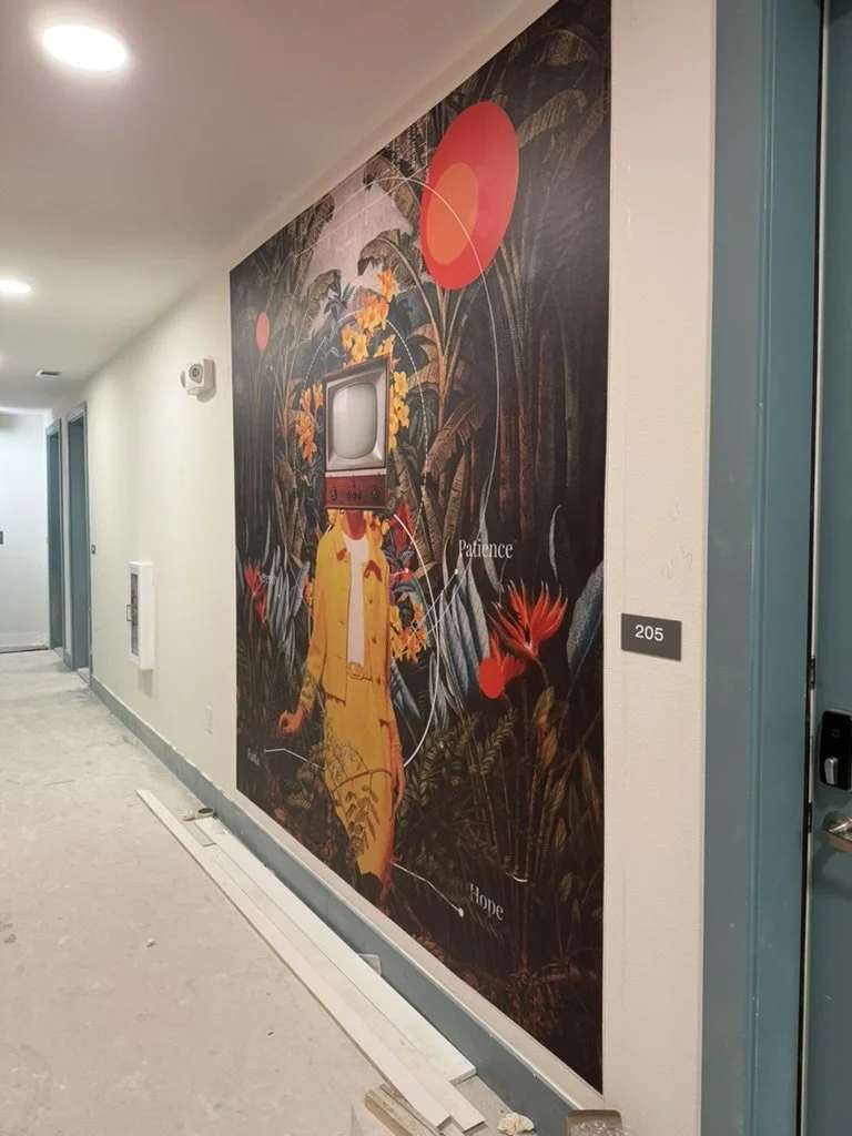 Installation of a surrealist botanical wall mural by Frank Moth in a corridor at East 9th in Dallas, TX, designed by Artbuckle & Co.