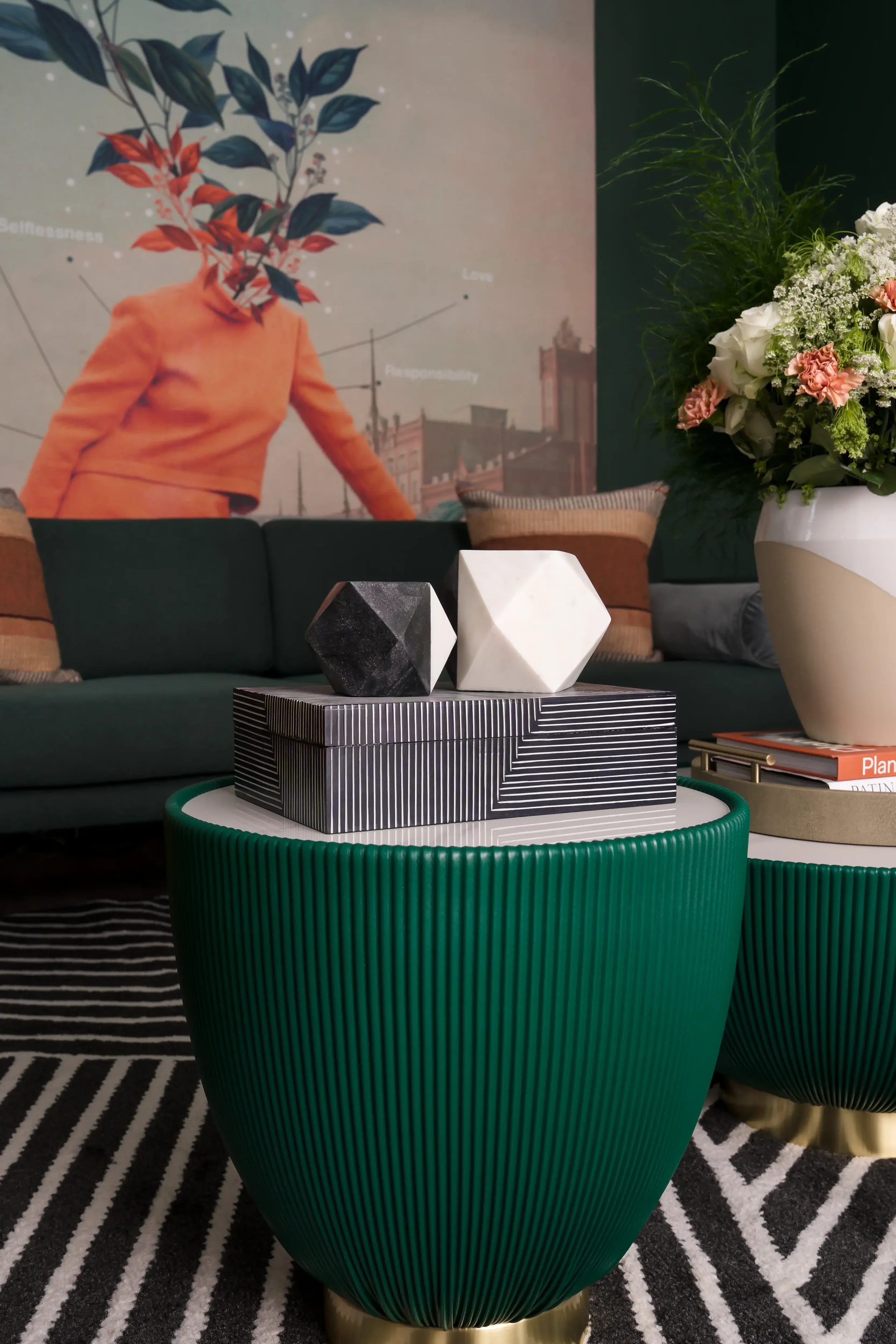 Green ottoman and geometric coffee table styling in the resident lounge at East 9th in Dallas, Texas, designed by Artbuckle & Co. 
