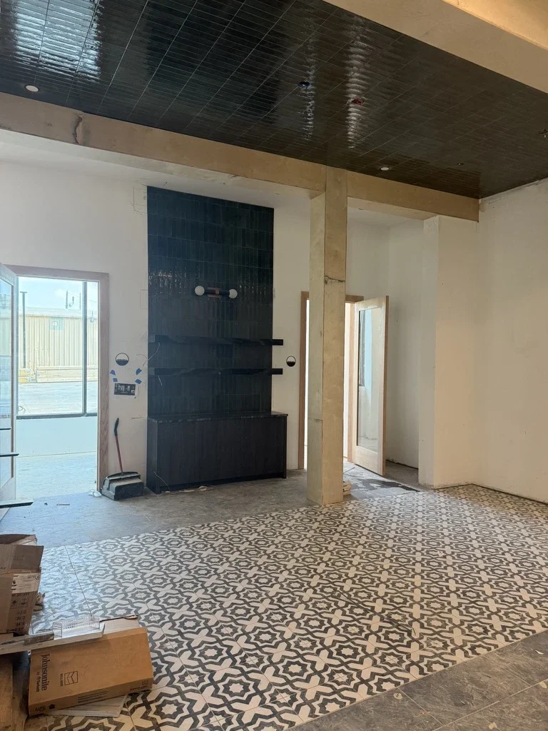 Lobby in progress at The Platform in Frisco, TX with green tile ceiling and patterned tile floor. Designed by Artbuckle & Co.