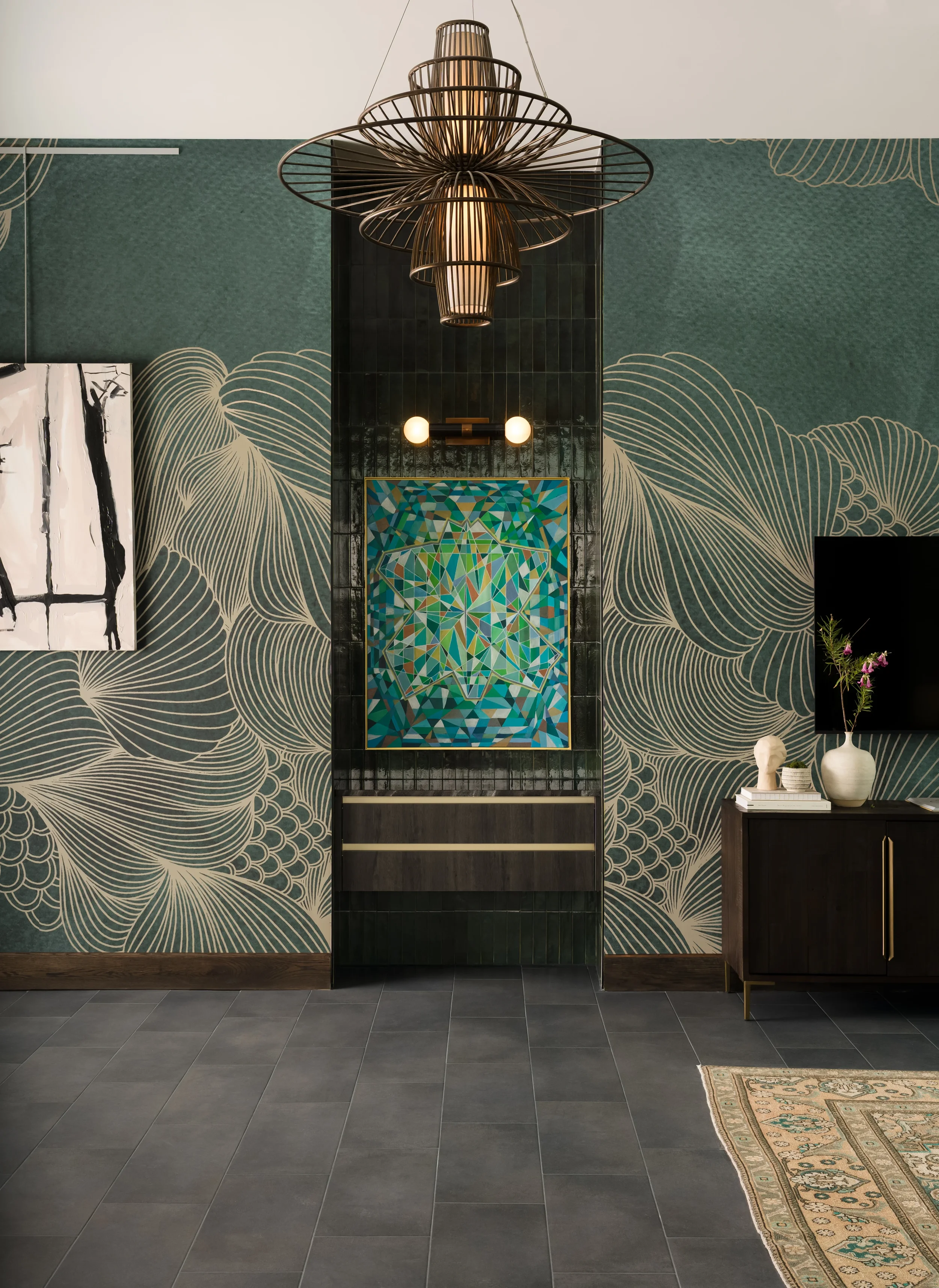 Entry vignette at The Platform in Frisco, Texas, with sage wallpaper in a gold line pattern, a green geometric painting, and a dark green tile feature wall, designed by Artbuckle & Co.