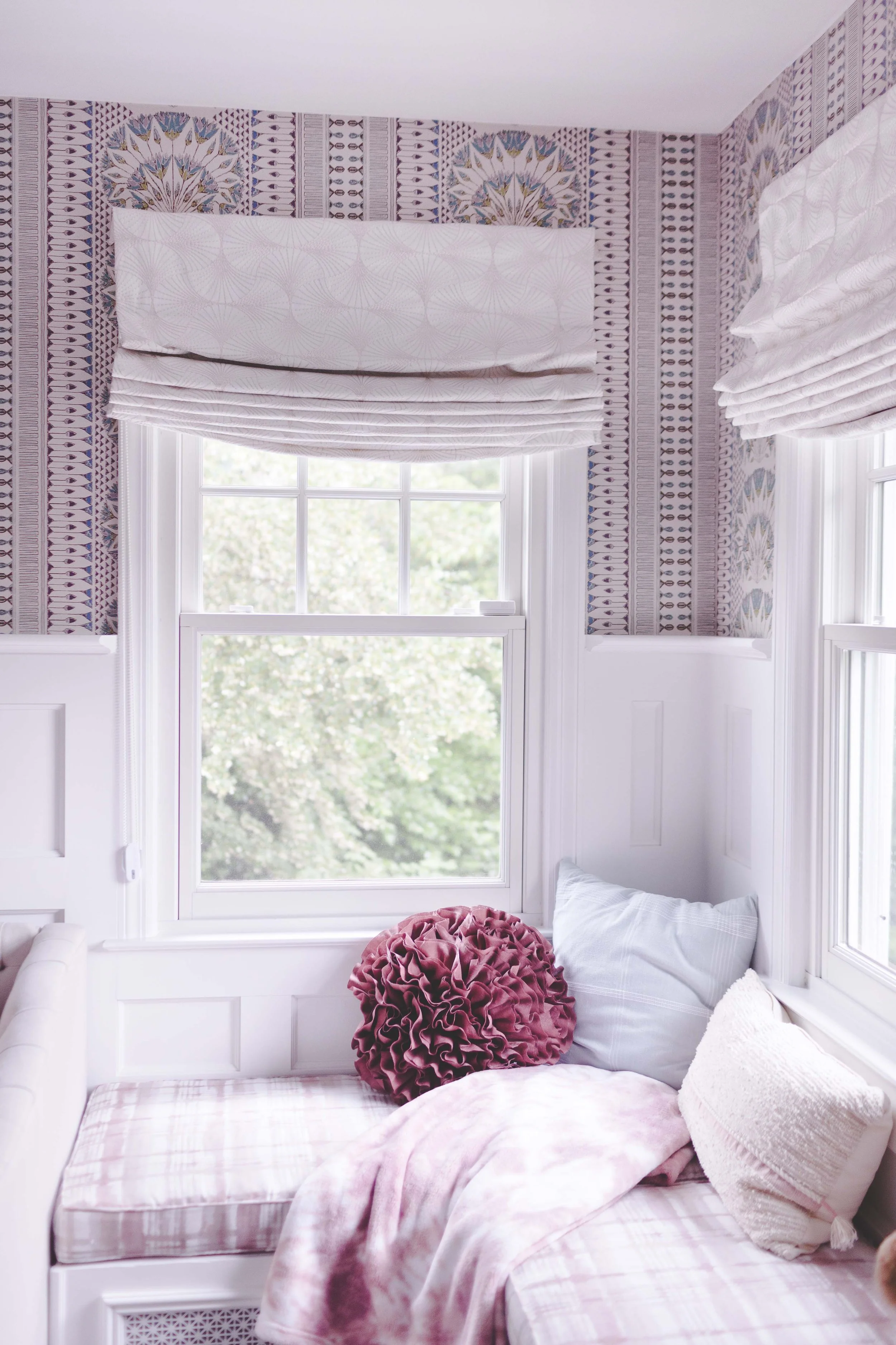 Indoor-outdoor sunroom and vibrant family spaces in the Moments on Madison project by Melissa’s Designs.