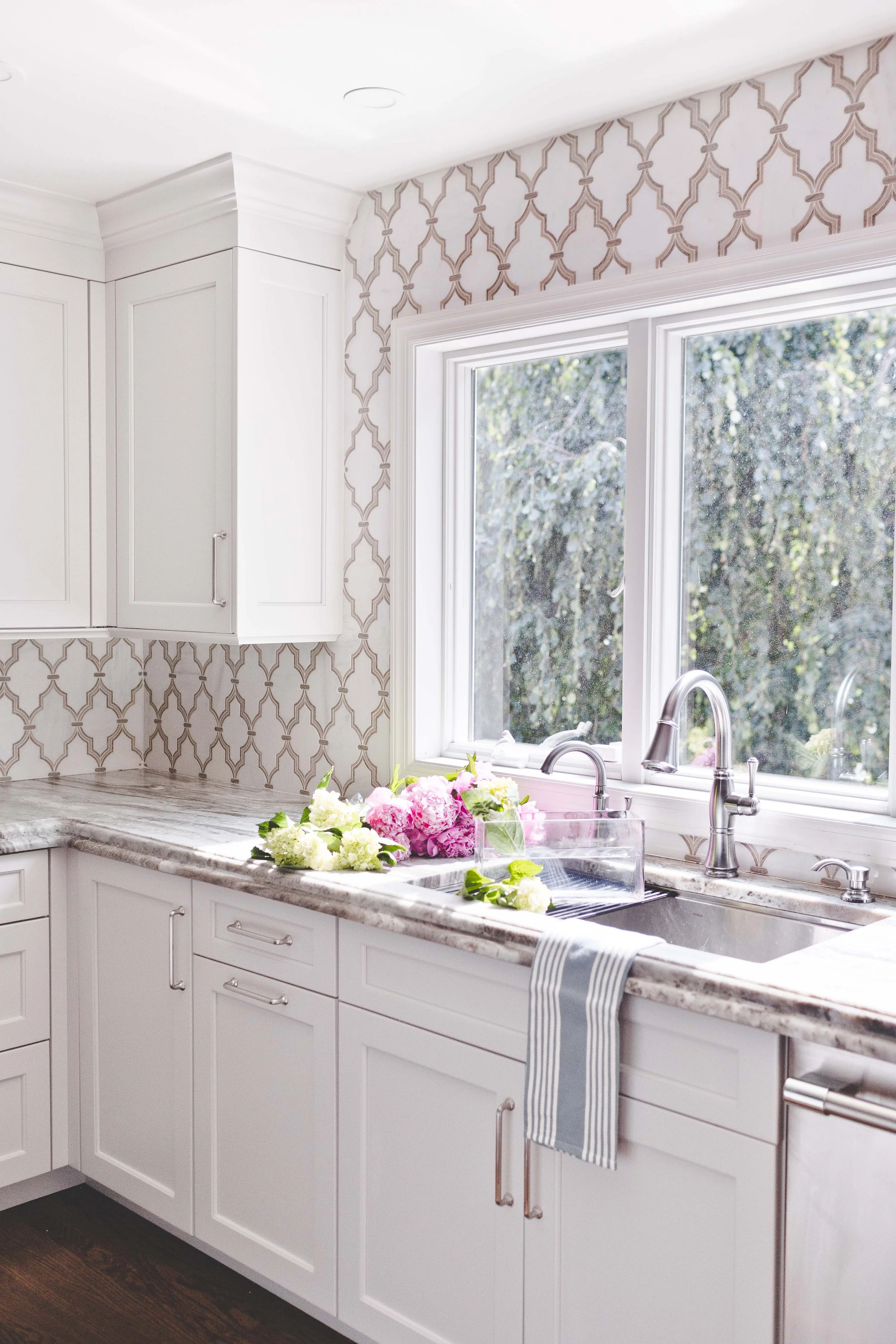 Chef-worthy kitchen and gathering spaces in The Heart of VanBlarcom project by Melissa’s Designs.