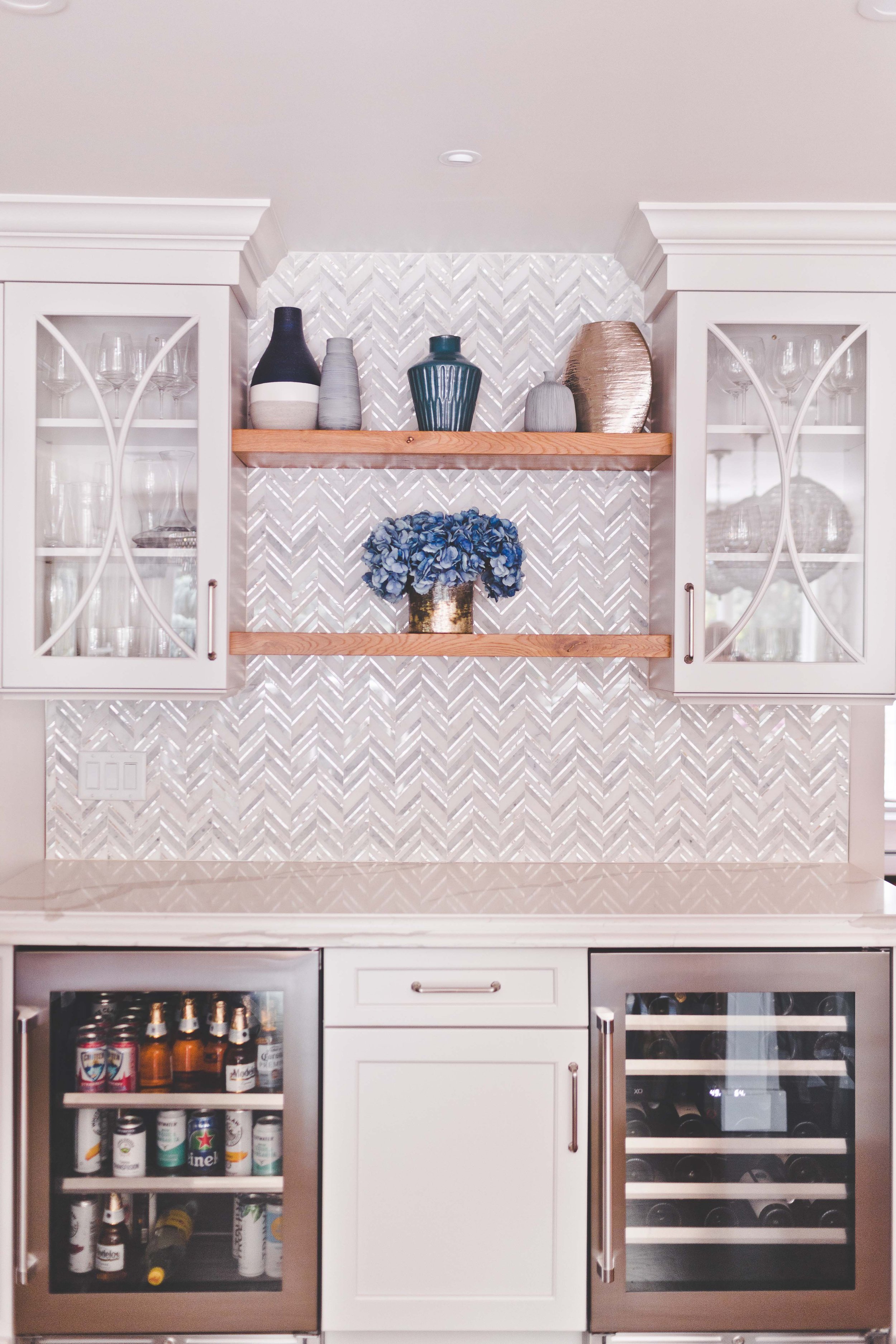 Chef-worthy kitchen and gathering spaces in The Heart of VanBlarcom project by Melissa’s Designs.