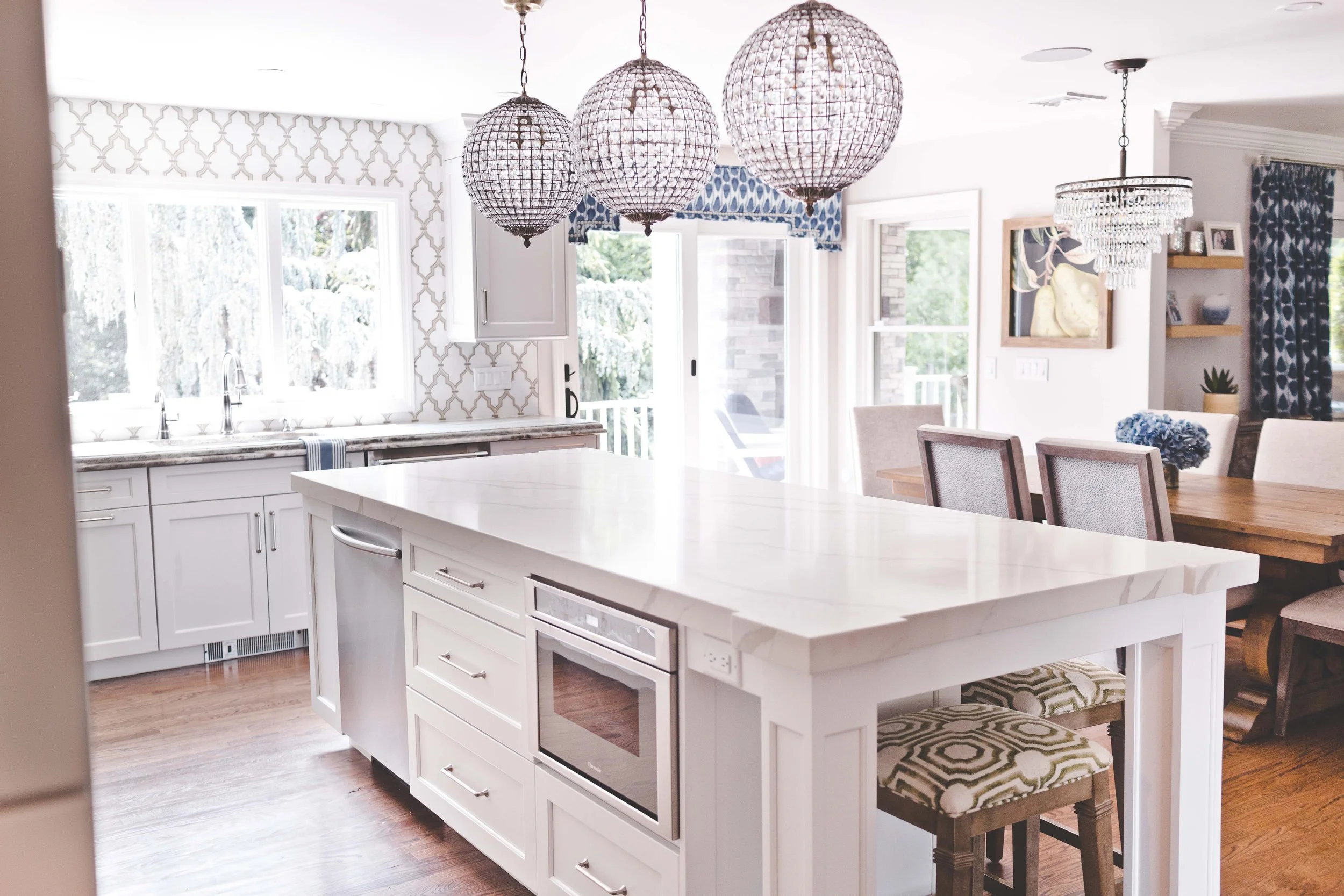 Chef-worthy kitchen and gathering spaces in The Heart of VanBlarcom project by Melissa’s Designs.