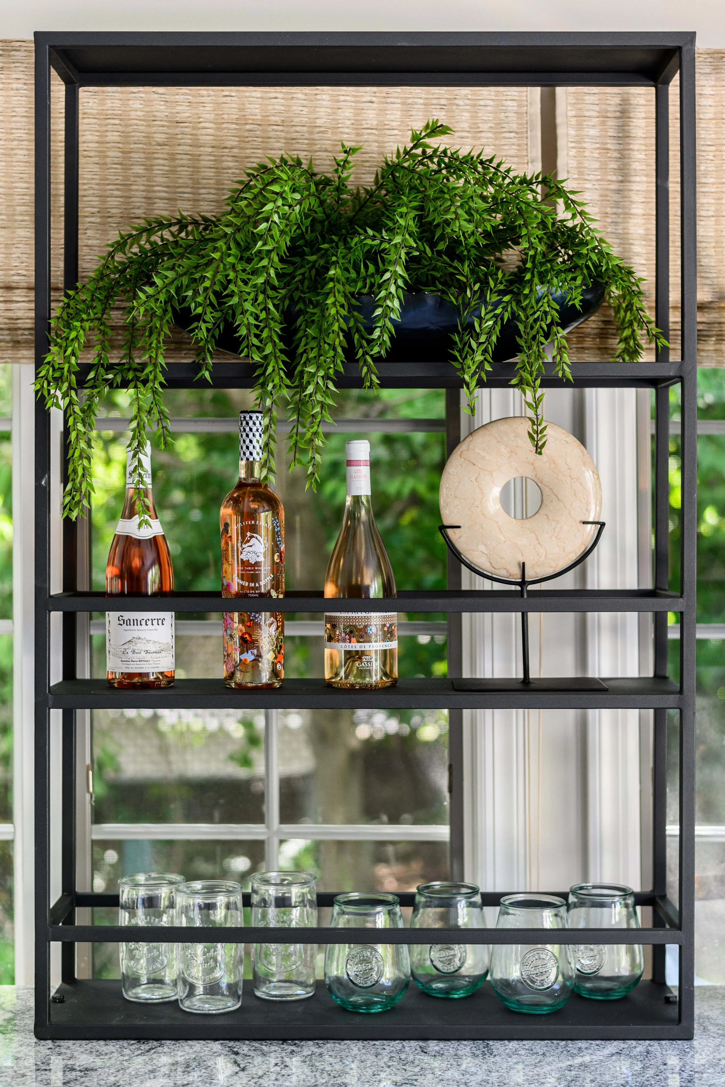 Indoor-outdoor sunroom and vibrant family spaces in the Moments on Madison project by Melissa’s Designs.