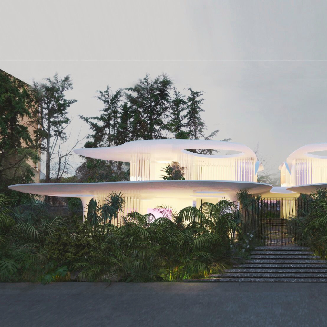 Modern white architectural building with curved, layered design, surrounded by lush green plants and trees, under a cloudy sky.